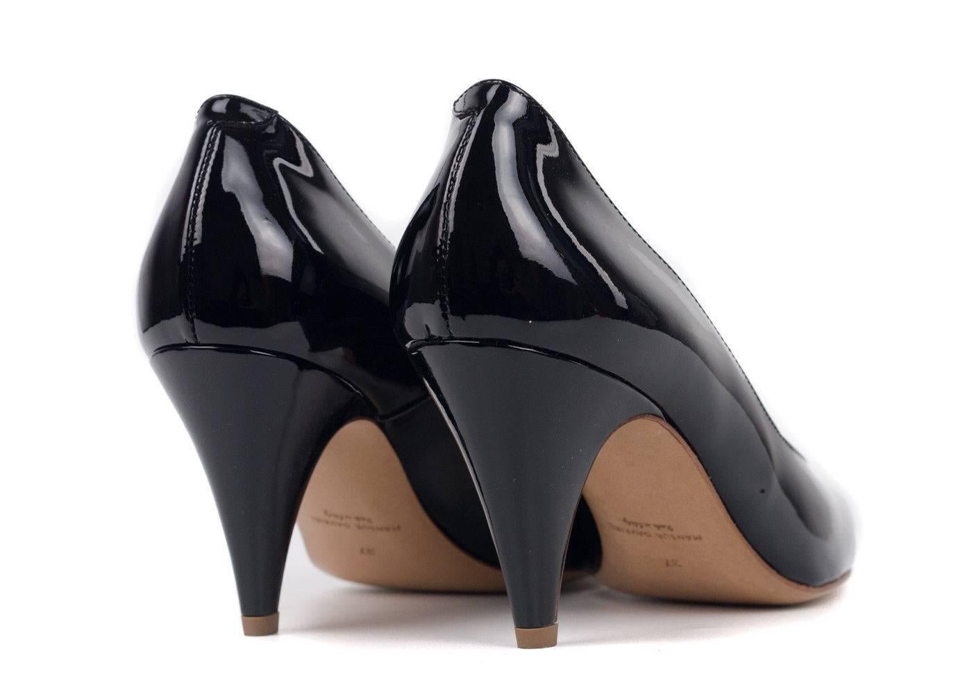 Every women needs a classic pair of black pumps. These Mansur Gavriel black heels are the perfect pair of black beauties to have and wear for years. Perfect for business wear and professional wear, pair yours with all black dress pants and white