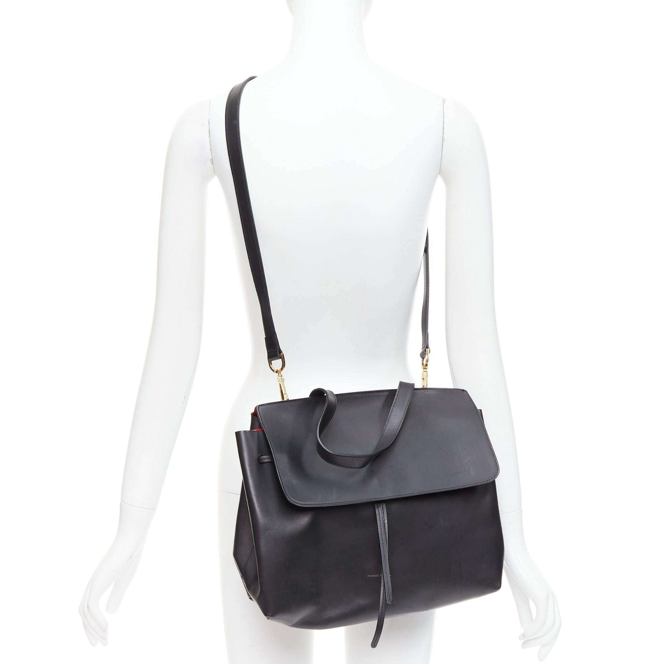 MANSUR GAVRIEL Lady black calfskin flap crossbody top handle messenger bag
Reference: ECLO/A00059
Brand: Mansur Gavriel
Model: Lady
Material: Leather
Color: Black, Gold
Pattern: Solid
Closure: Drawstring
Lining: Red Leather
Extra Details: MANSUR