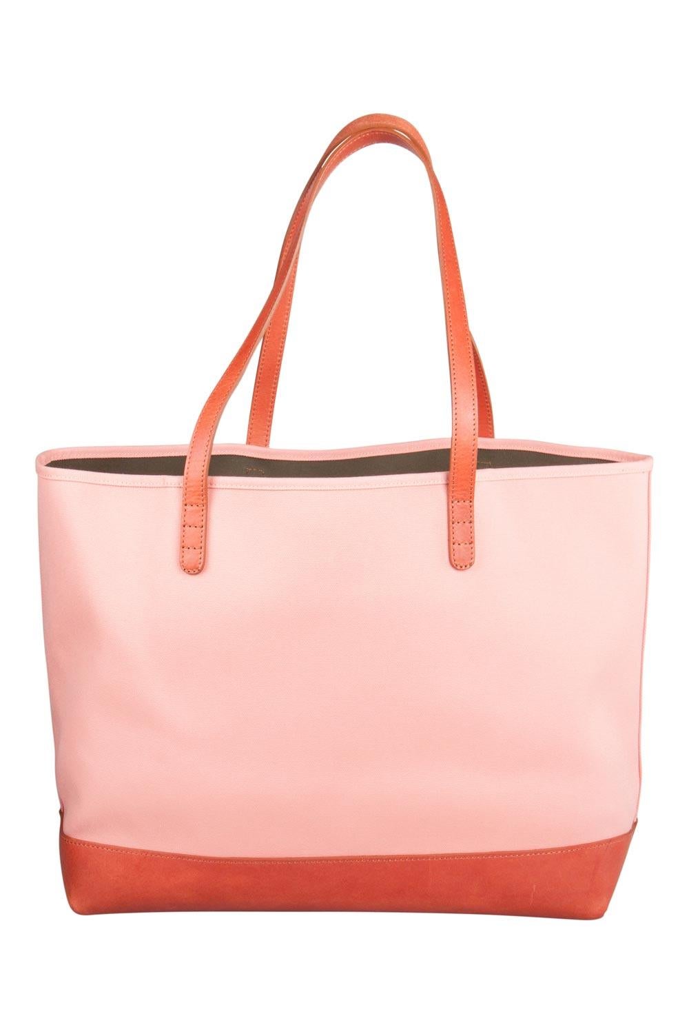The tote from Mansur Gavriel is a timeless piece. The bag is crafted from canvas and leather and flaunts a combination of warm hues. It features double top handles. The bag opens to reveal a spacious interior with a zipped pouch and enough space to