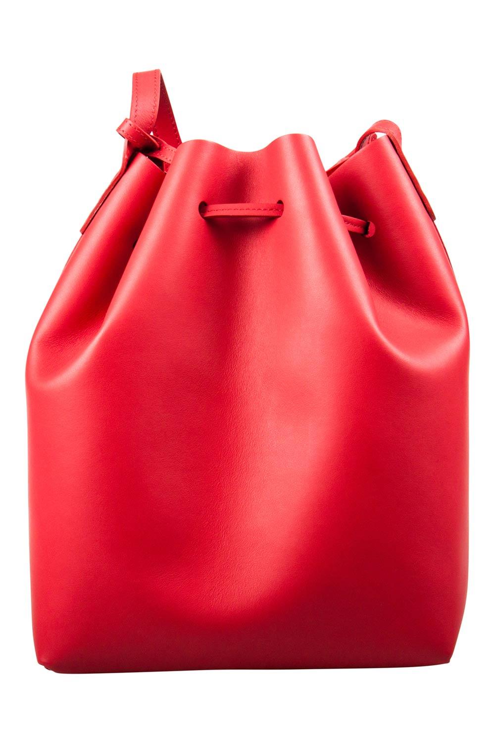 This wonderful Mansur Gavriel creation is made from leather and enhanced with gold-tone hardware. The bag has a bucket shape with a drawstring closure that secures the leather interior. It is complete with a shoulder strap. Red in color, it is an