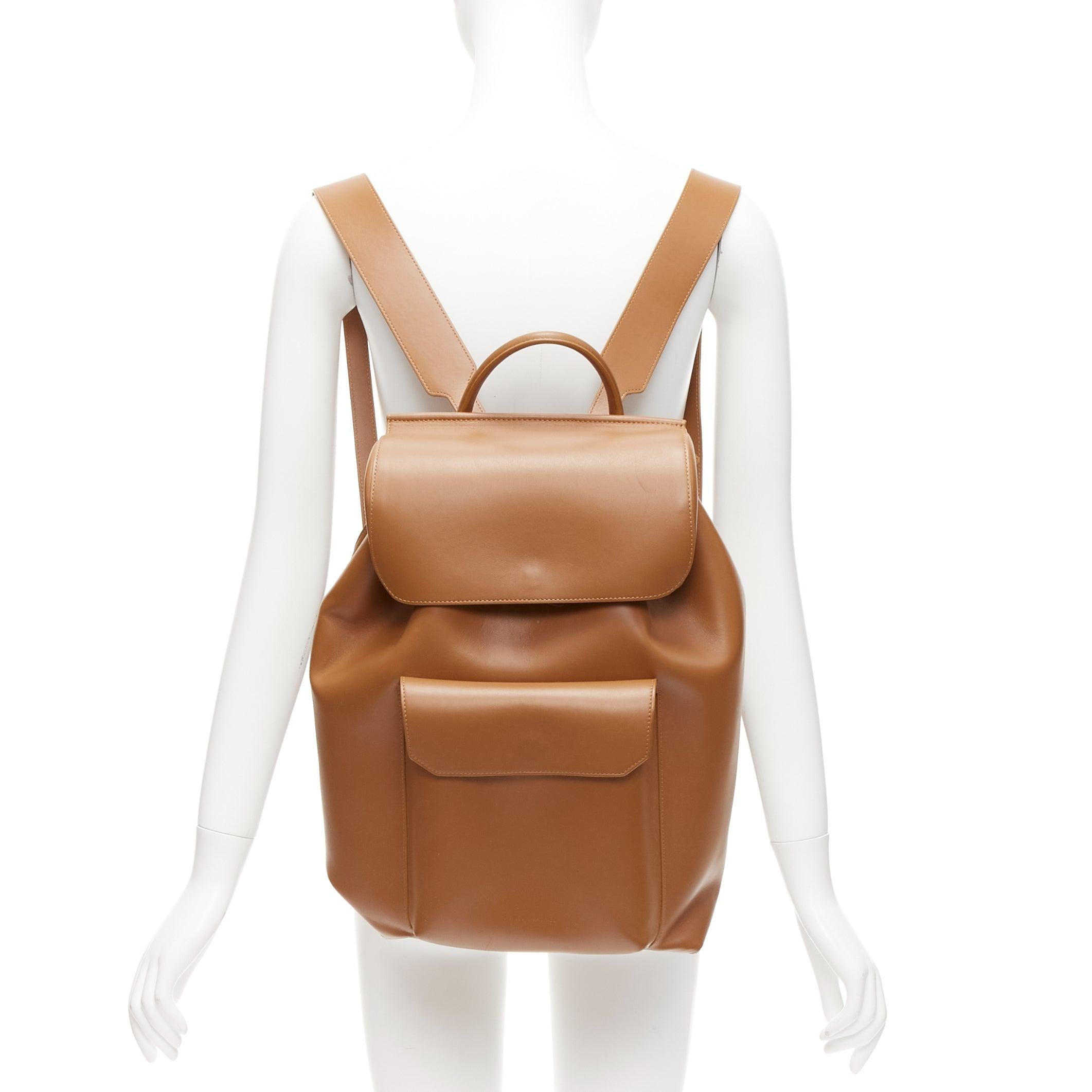 MANSUR GAVRIEL vegetable tanned calfskin leather minimal classic backpack bag
Reference: JACG/A00098
Brand: Mansur Gavriel
Material: Leather
Color: Brown
Pattern: Solid
Closure: Snap Buttons
Lining: Beige Fabric
Extra Details: Vegetable Tanned