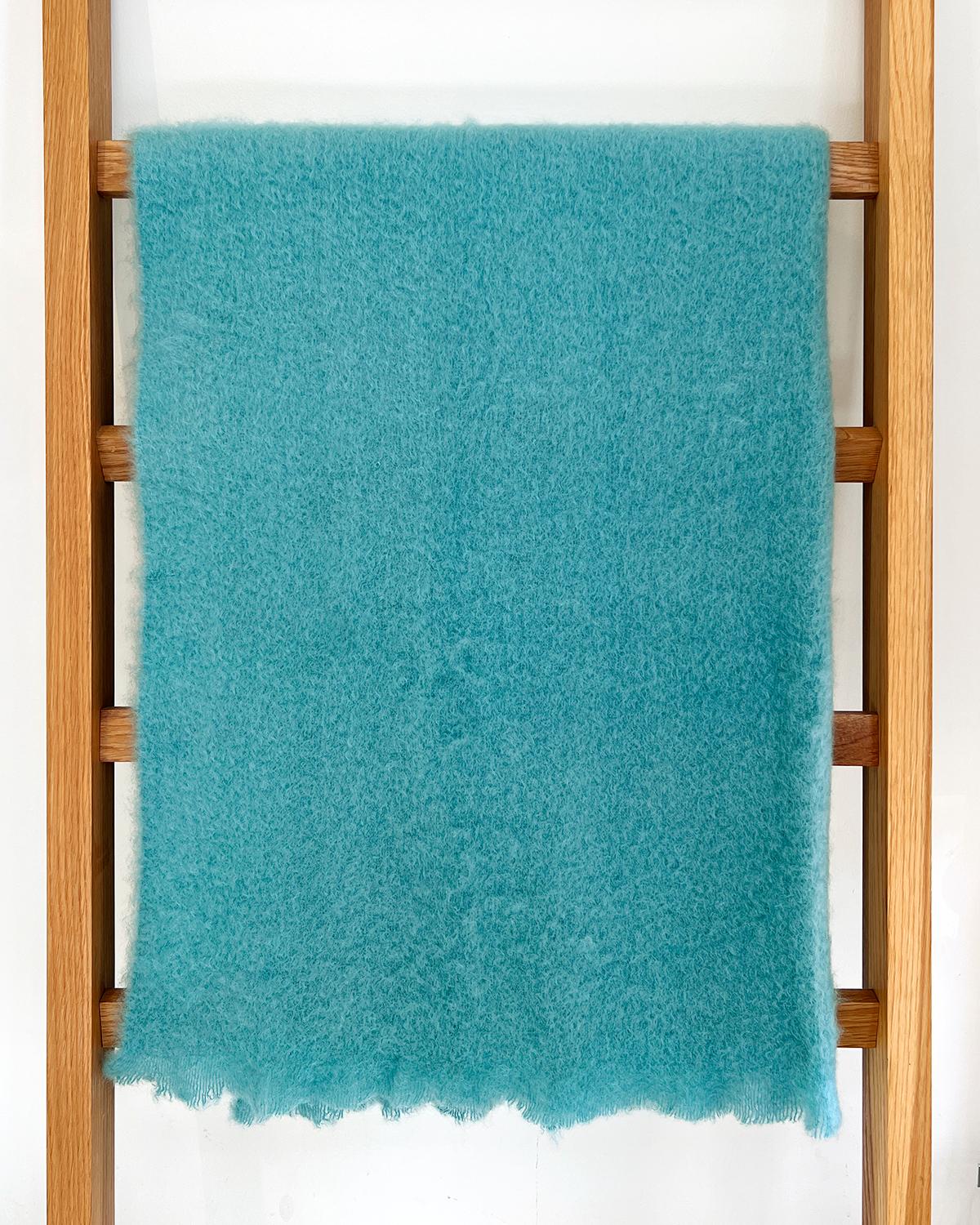 Mohair blankets will keep you cozy and warm this winter. When cold weather happens, wrap yourself up in this beautiful Aquamarine Mohair Throw and stay cozy. This beautiful blue/green color will light up the room and add a pop of color and