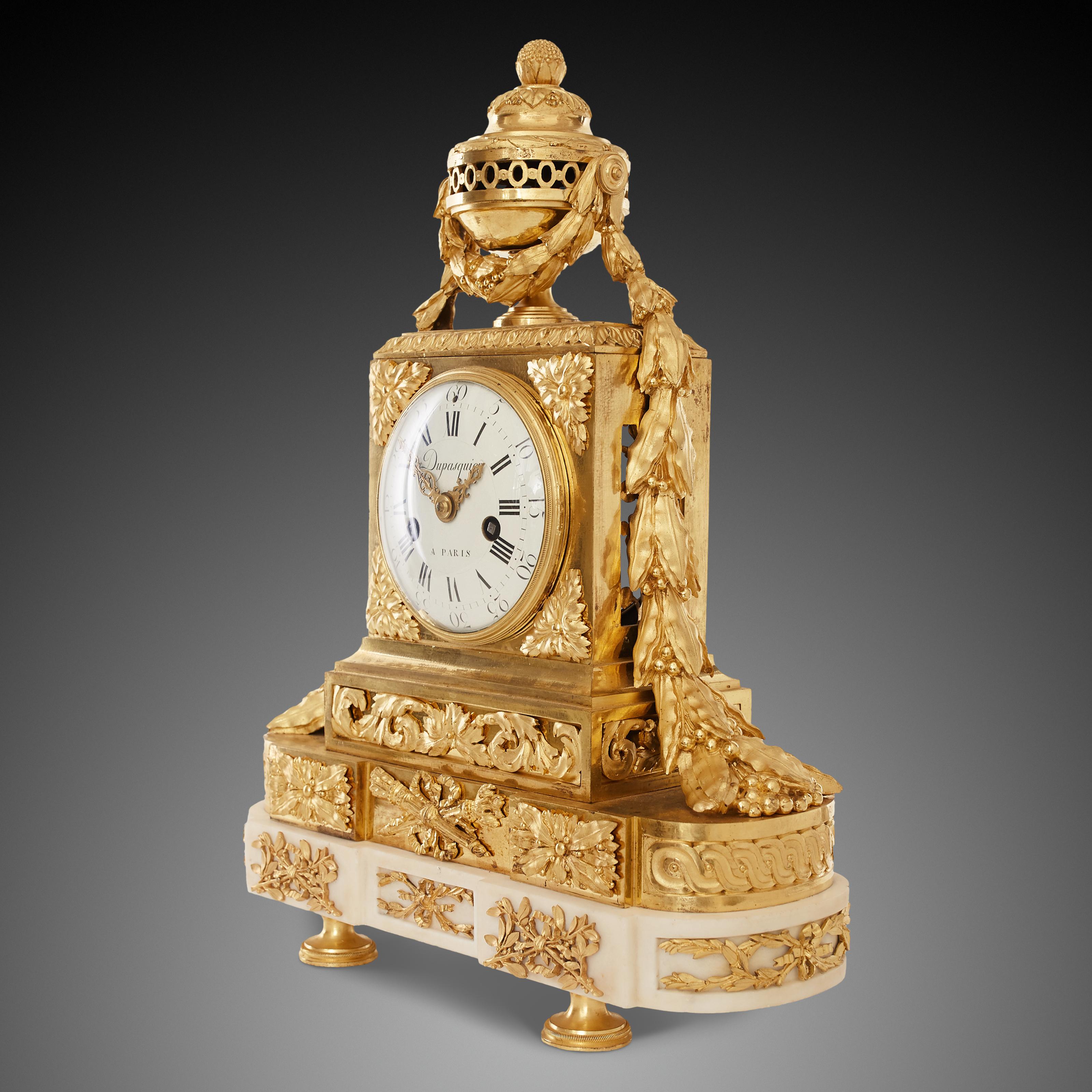 The outstanding mantel clock is in the style of Louis XV – Louis Seize (1774-1792). Royal breath appears in each motif. Almost the entire upper part of the clock is inlaid with ormolu but only the pedestal is made of extremely delicate ivory-white