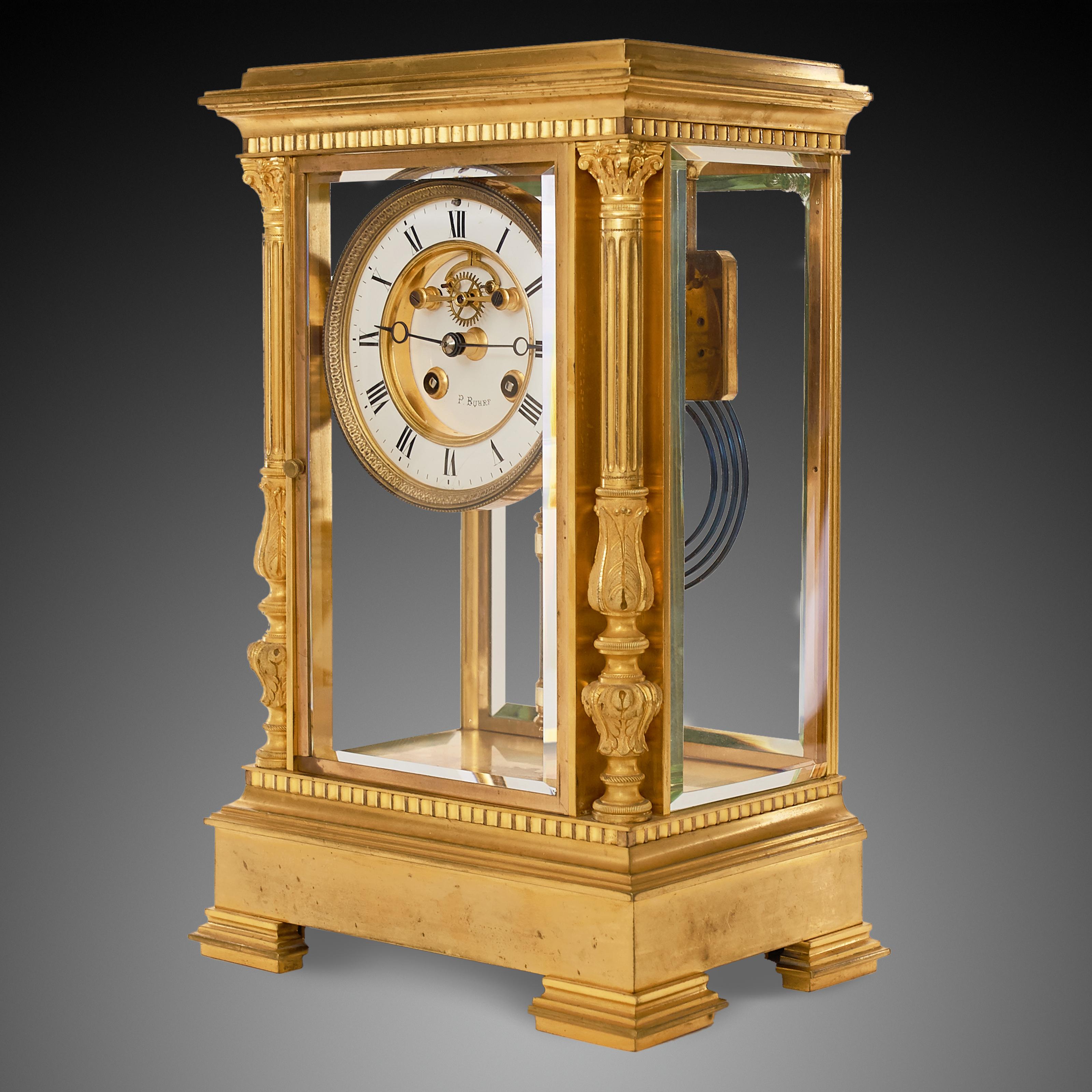 A late Victorian French four glass and brass mantel clock with open jewelled escapement.Eight day movement with outside countwheel striking the hours and halves on a blued steel coiled gong. Mercury pendulum and dial signed P.BUHRF.