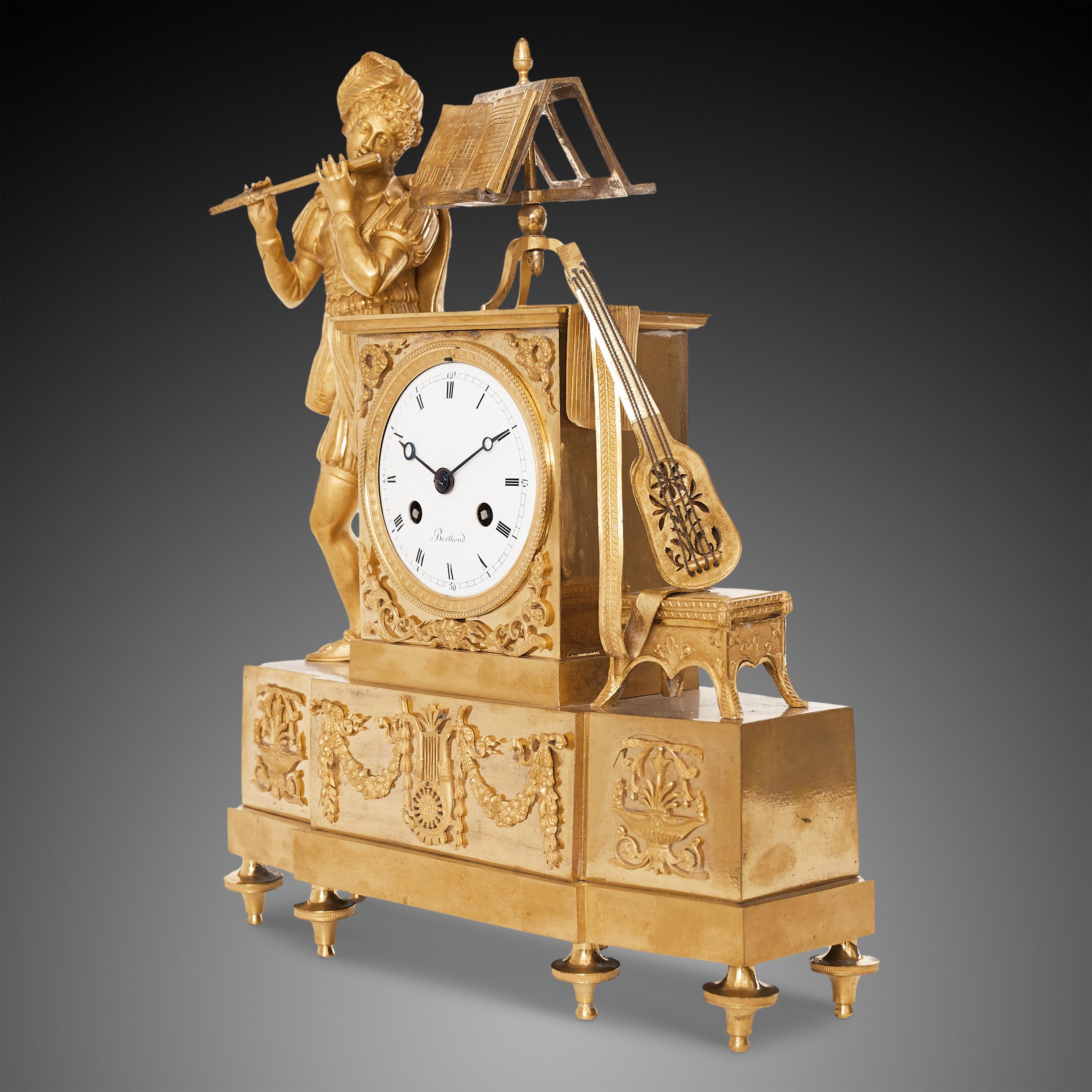 Ormolu bronze mantel clock flanked by a troubadour and musical instruments, signed 'Ferdinand Berthoud a Paris'. 
The end of the 18th and beginning of the 19th century was a crucial time in which new technological advances helped to make watches