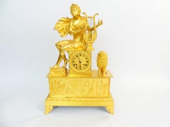 Mantel clock from the French Empire of the early 19th century 'Apollo, playing