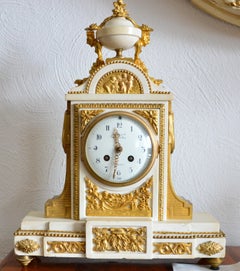 Orologio da camino in bronzo dorato e marmo