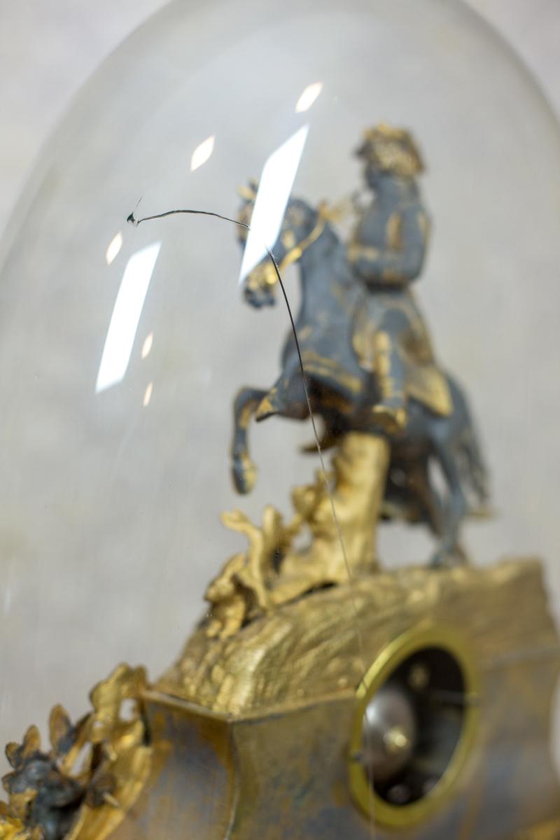 clock in a glass dome