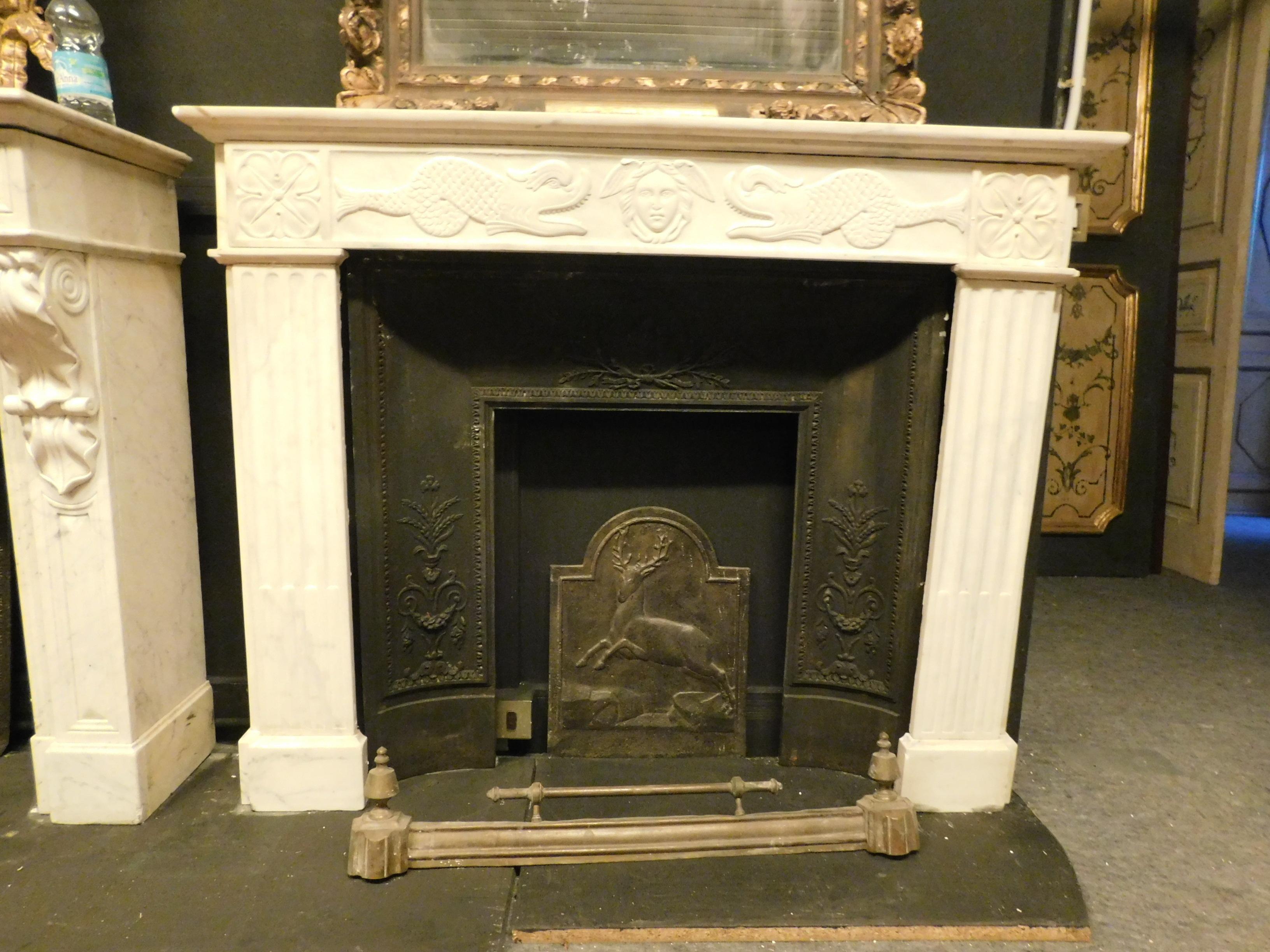 Ancient fireplace mantle in white Carrara marble, richly carved with maritime symbols such as tritons and medusa, coming from the maritime area of liguria in italy, built and sculpted by hand in the 19th century.
Light and sunny, of good material