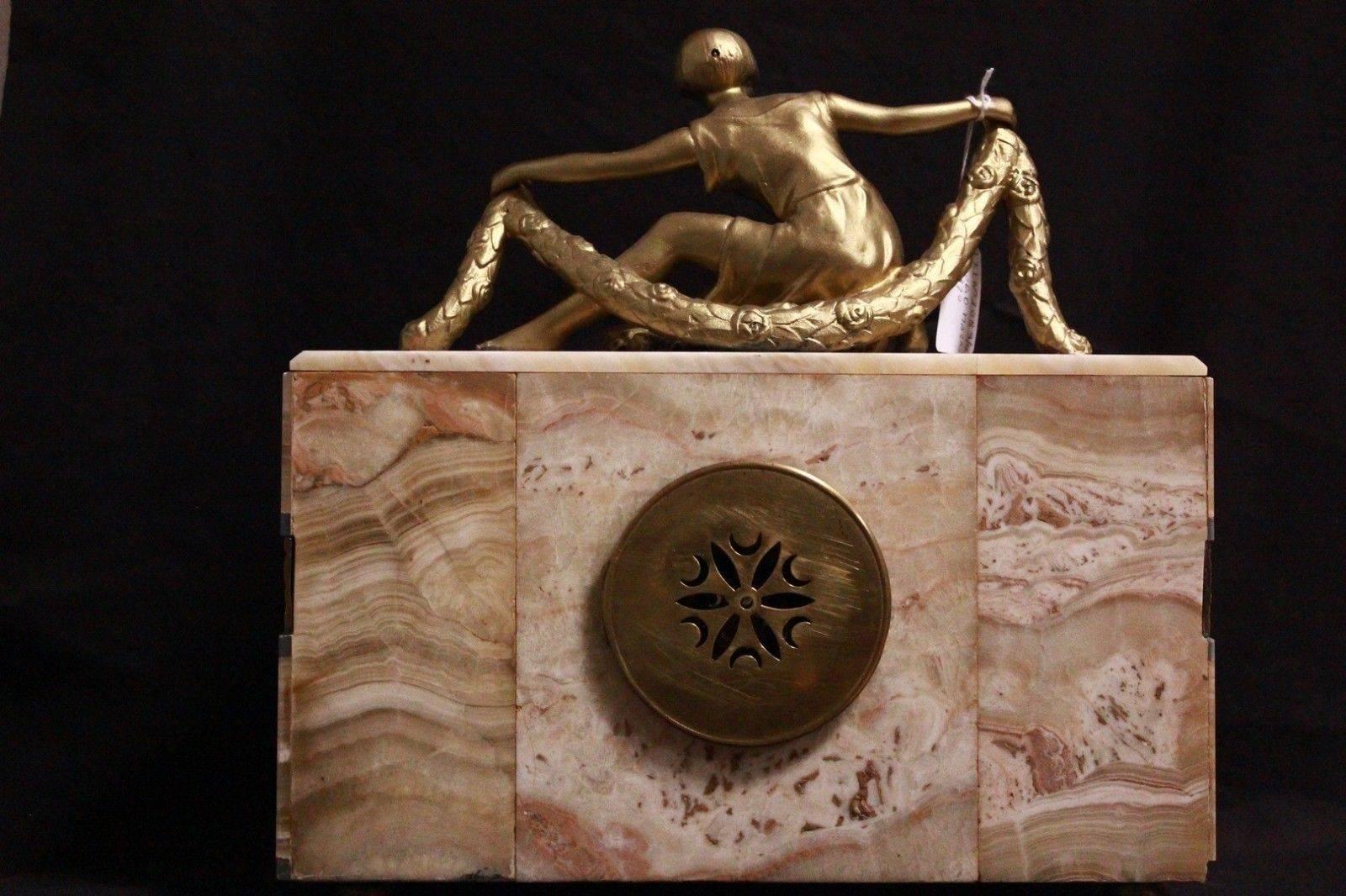 Important marble Art Deco mantel clock from the early 1900.
Measurements: Width 34 cm, depth 11 cm, height 37 cm.

A French Empire-style mantel clock is a type of elaborately decorated mantel clock made in France during the Napoleonic Empire