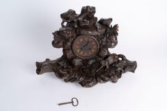 Orologio da caminetto, orologio in legno intagliato, artigianato della Foresta Nera del XIX secolo.