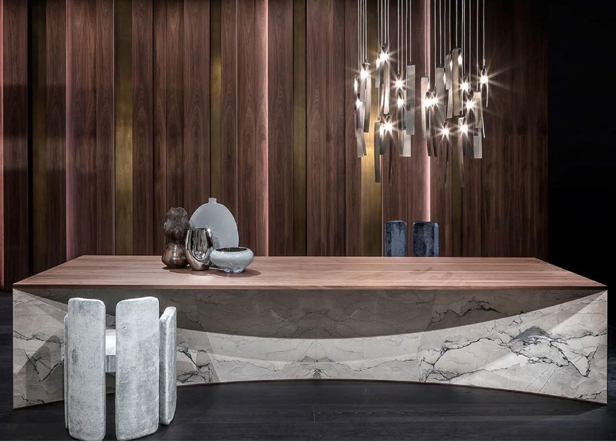 Designed by Elena Pancaldi, Mantica is more than just a table – it is a sculptural statement. Featuring intersecting curved tops, the design creates a dynamic play of volumes. The top and underside are made of veneered multilayer wood, while the