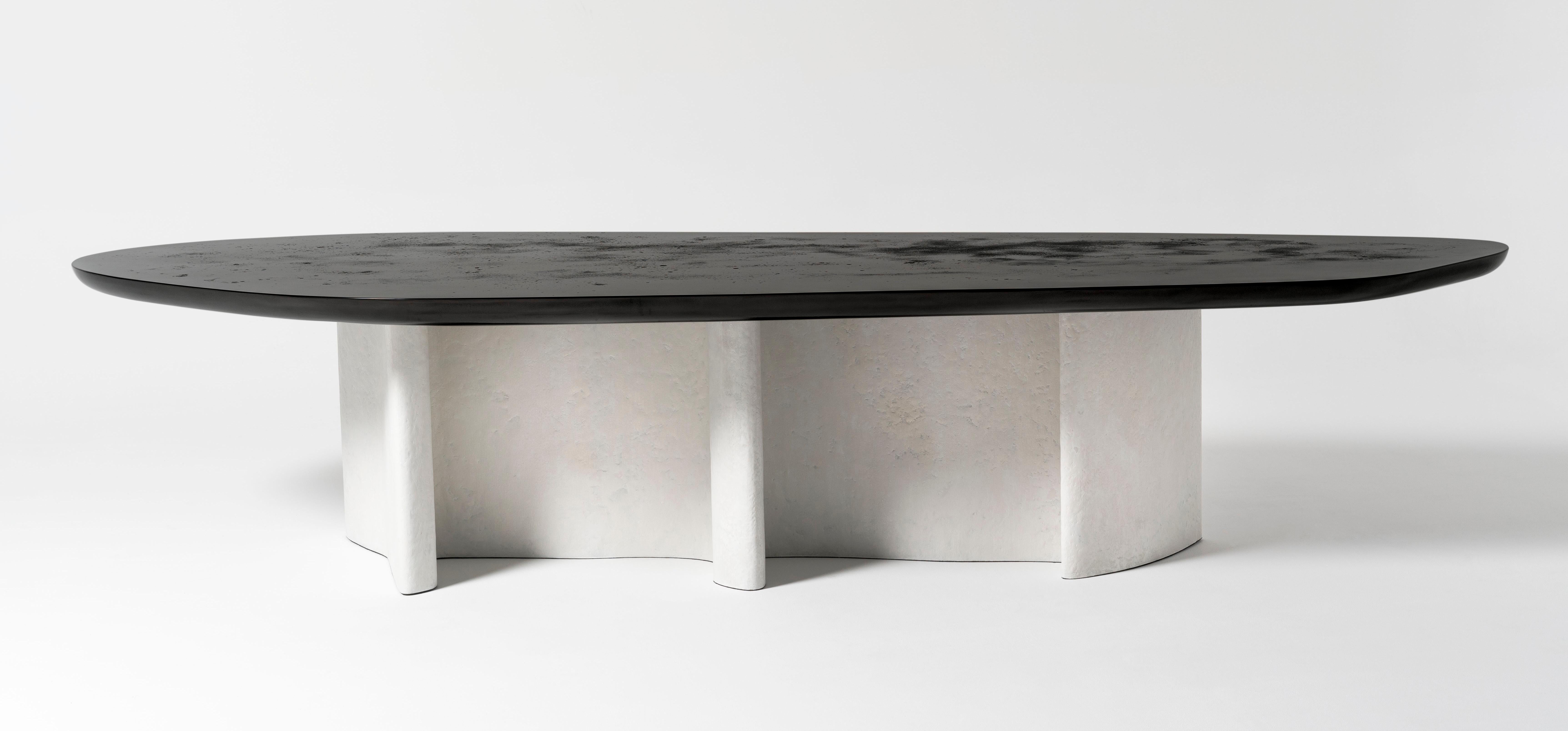 Mantle - 21st century contemporary rounded sculptural large dining table

Inherited the meandering shape of the mantle ray, the Mantle table base is like a swimming ray in the ocean depth. Its organic form contrasts with its structure that resembles