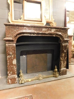 Mantle fireplace, carved in veined Red marble with vents, France