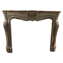 Mantle fireplace in black Belgian marble, carved with shells, France
