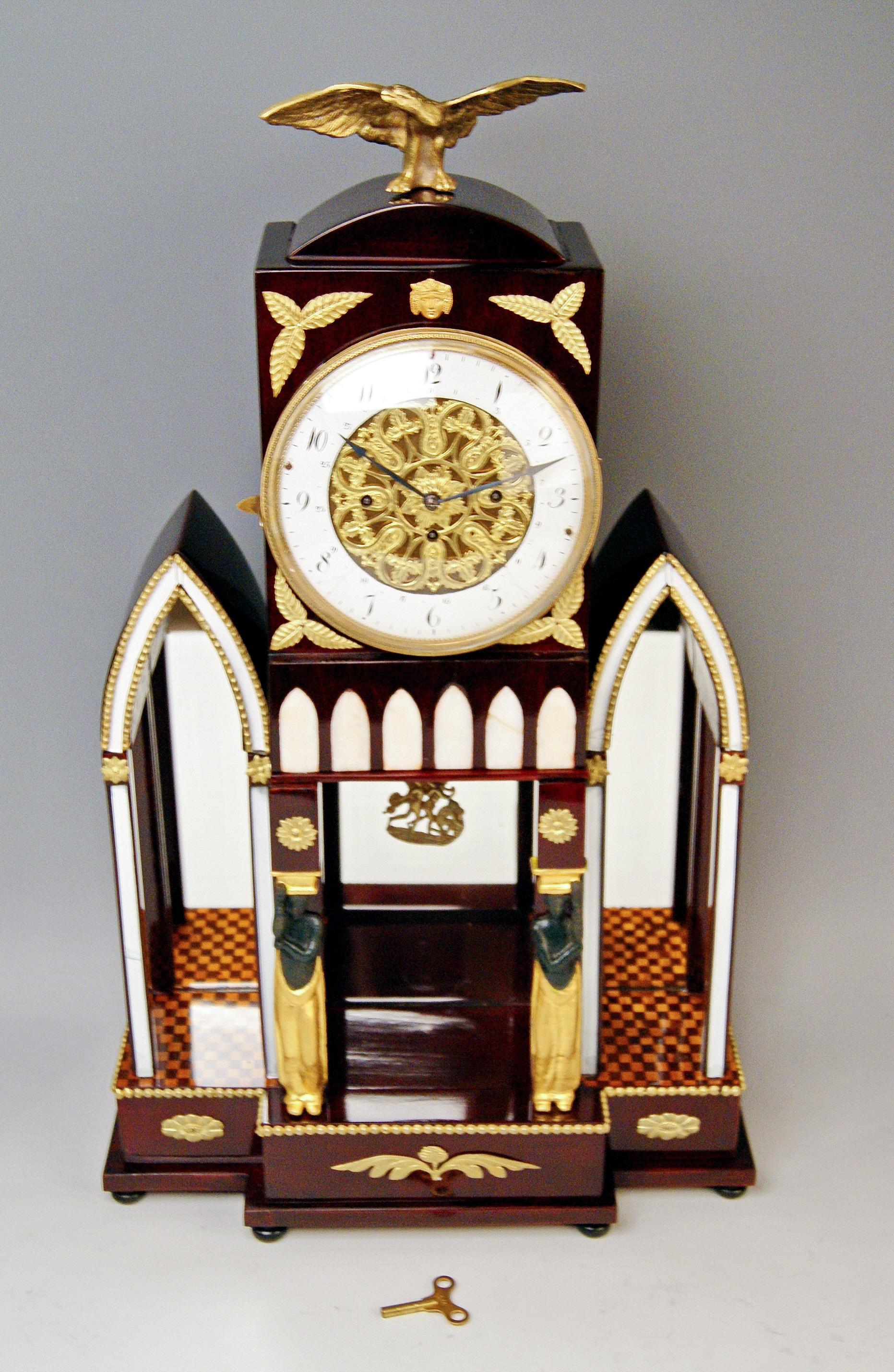 Viennese mantle / mantel / table chiming clock Empire style

Date of manufacture: circa 1810-1820

Material:
The clock's chest is made of stained dark mahogany wood / refurbished and hand-polished
ENAMEL CLOCKFACE (Arabic numerals) / BRASS