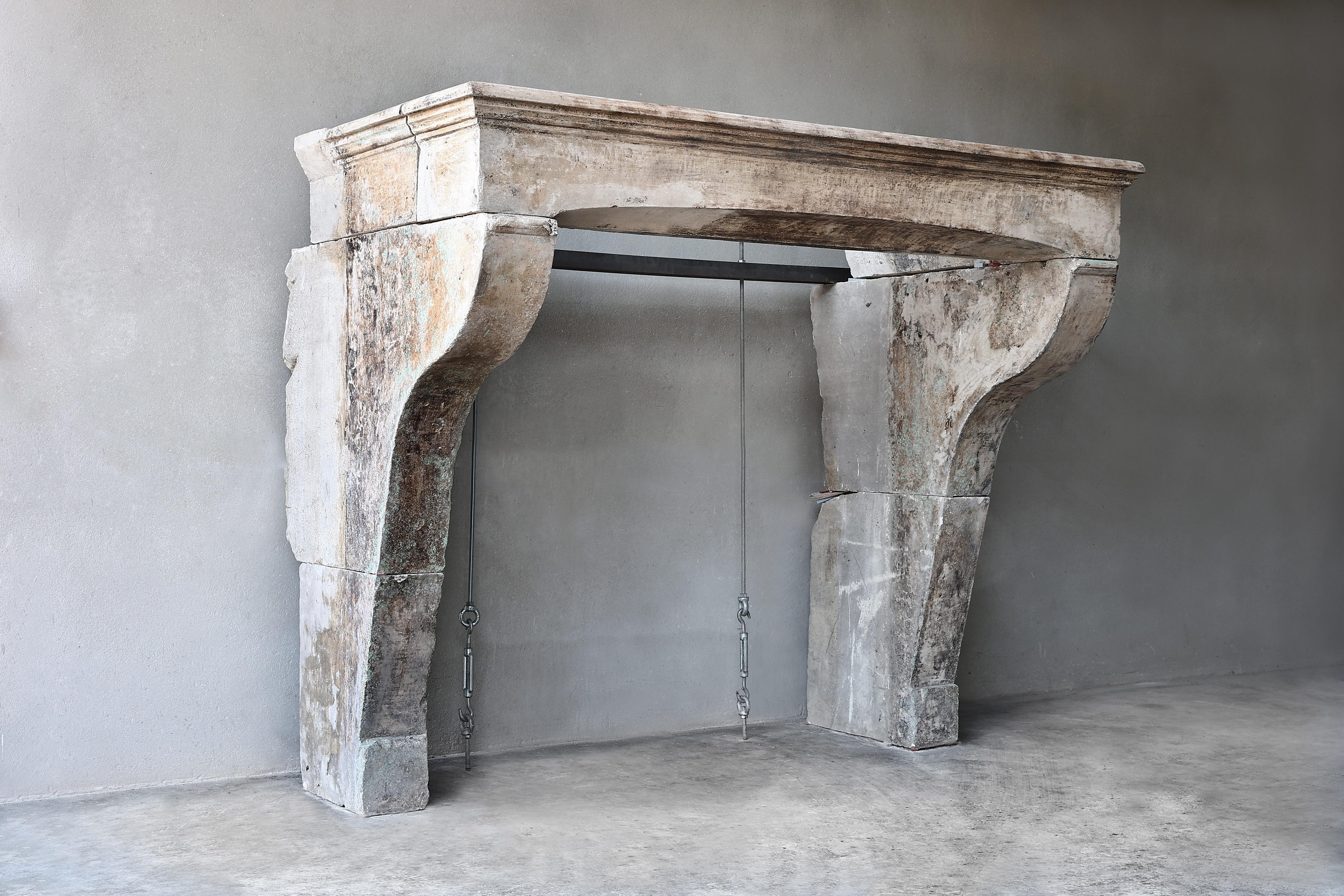 Antique Mantle Surround in French Limestone from the 19th Century in Campagnarde Style
Beautiful rustic French limestone mantle from the 19th century. An antique fireplace with beautiful lines in the front part and slightly curved legs! The