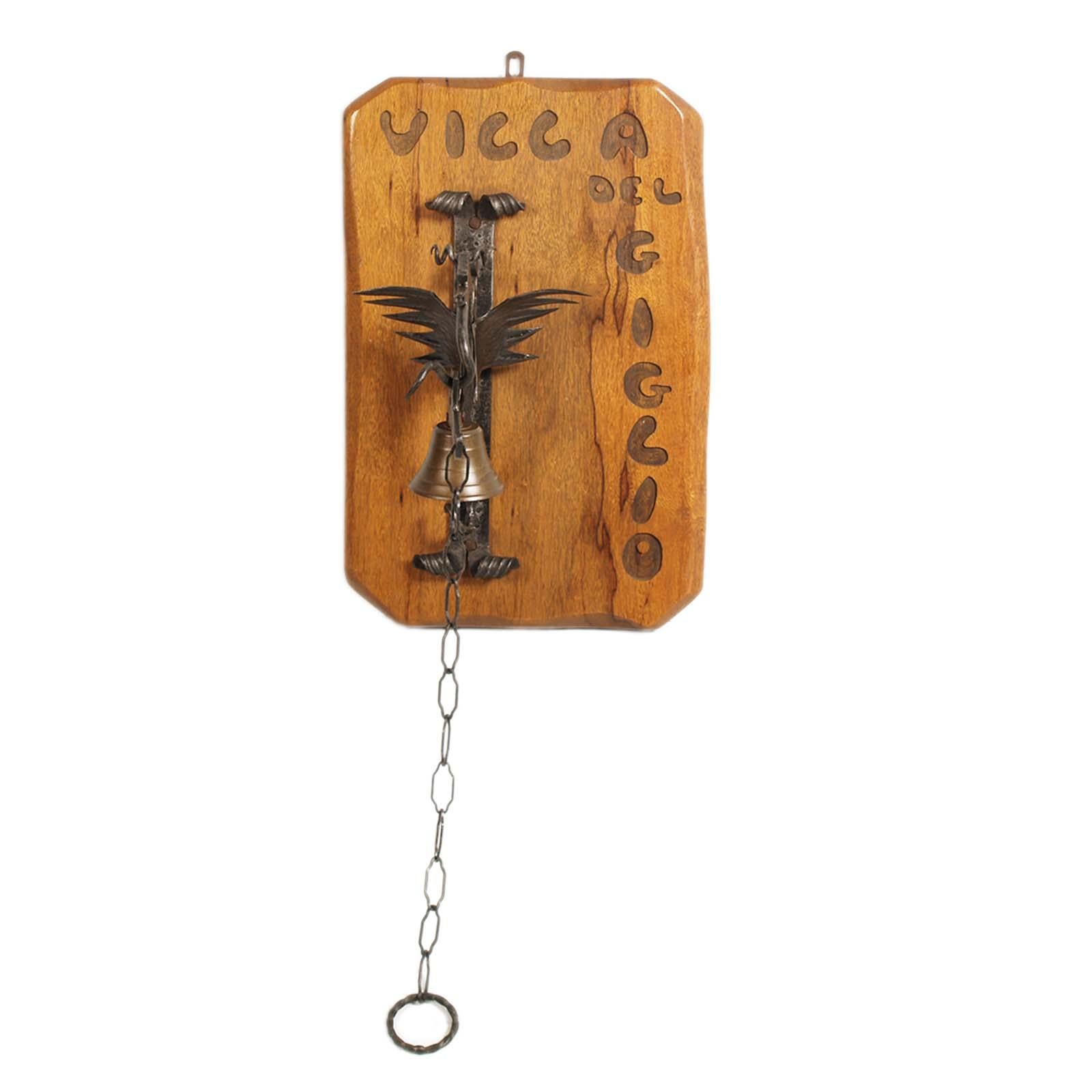 Manual entrance bell in wrought iron, Tyrolean craftsmanship from 1950
The wrought iron structure is a classic stylized dragon figure, very common in the Austrian Alto Torolo area.

We wax polished the wooden support, bringing it back to its best