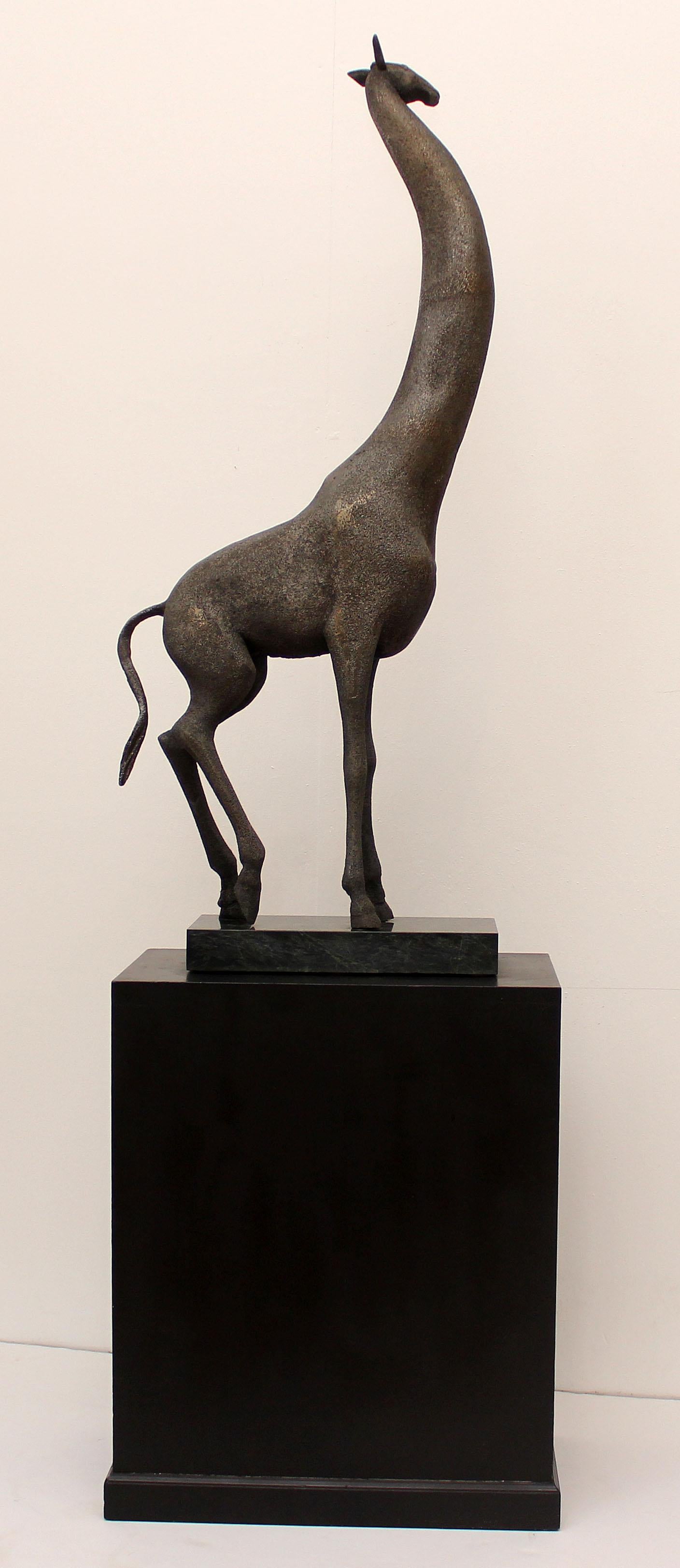 A large and early sand cast aluminum modernist sculpture of a giraffe by Cuban American artist Manuel Carbonell. Pedestal included. Measures: Height is 73” with base.
Carbonell’s early sculptures where sand cast and unique. This is an edition of