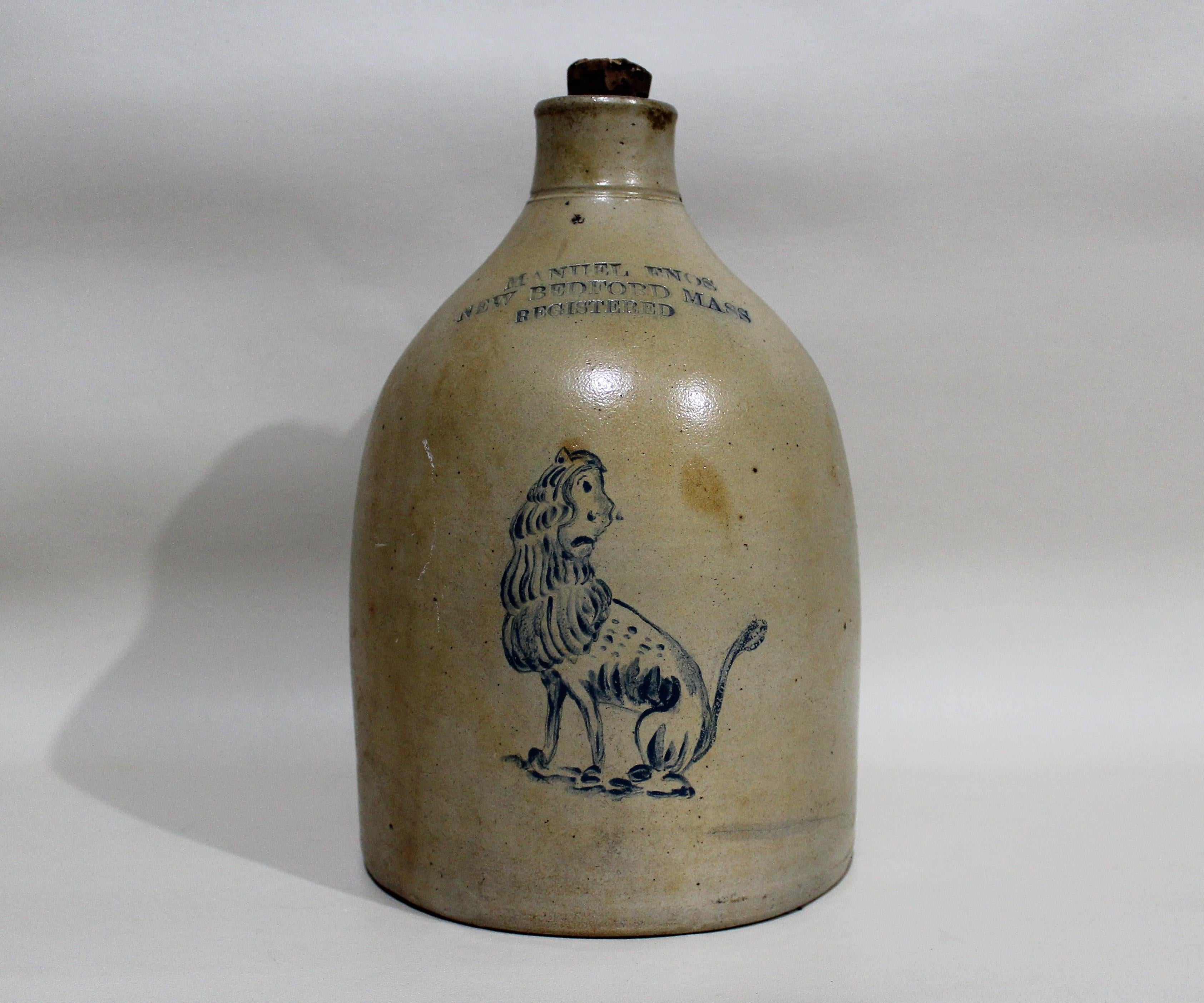 Manuel Enos of New Bedford Massachusetts stoneware whisky jug with painted lion. Captain Manuel Enos (1827-1915), known as Big Manuel, was born on the Azores Islands. He rose through the ranks as he sailed on Cold Spring Harbor’s Huntsville and