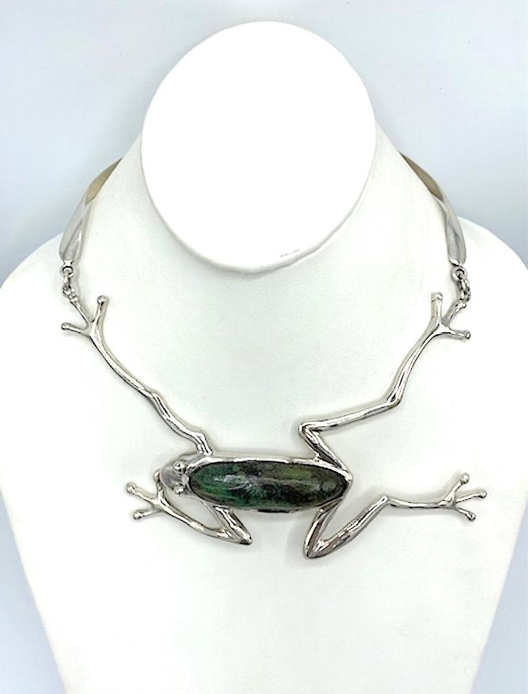 A rare and unique necklace made by the celebrated Taxco, Mexico silversmith Manuel Porcayo Figueroa. It is all hand made in sterling silver and set with a large oblong Chrysocolla stone native to Mexico. The frog measures 6.25 inches wide and 4