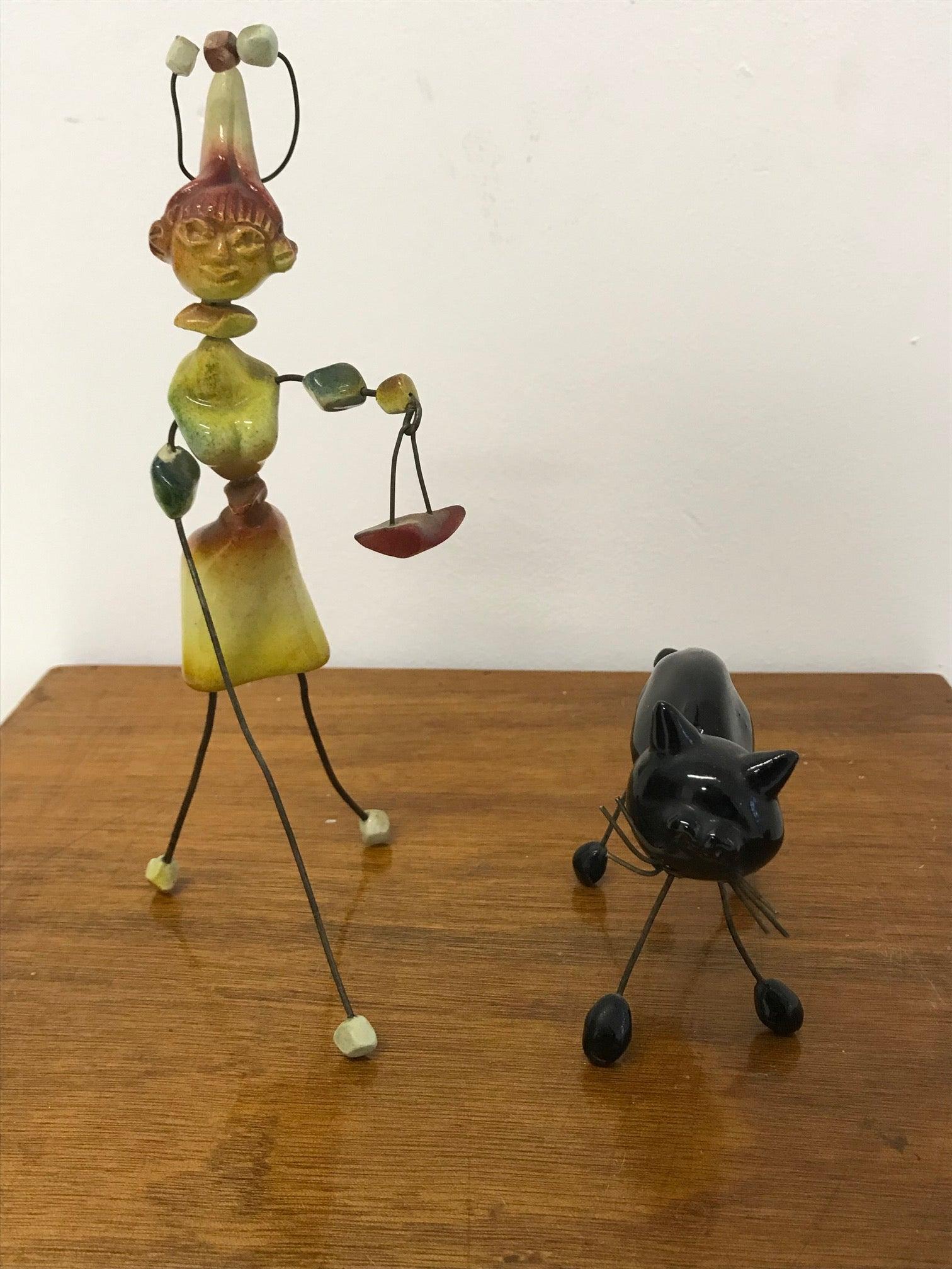 Manufacture Accolay, rare small ceramic sculpture assembled using metal wires.
Measures: Height of the woman 22 cm, height of the cat 8.5 cm.