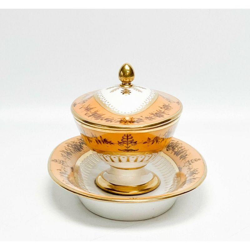 Manufacture De Sevres gilt porcelain lidded sauce bowl Nankin Yellow, 1815-1824.

Manufacture de Sevres porcelain lidded sauce dish with fixed underplate, 1815-1824. A white ground to center, a nankin yellow ground to the edge with brown painted