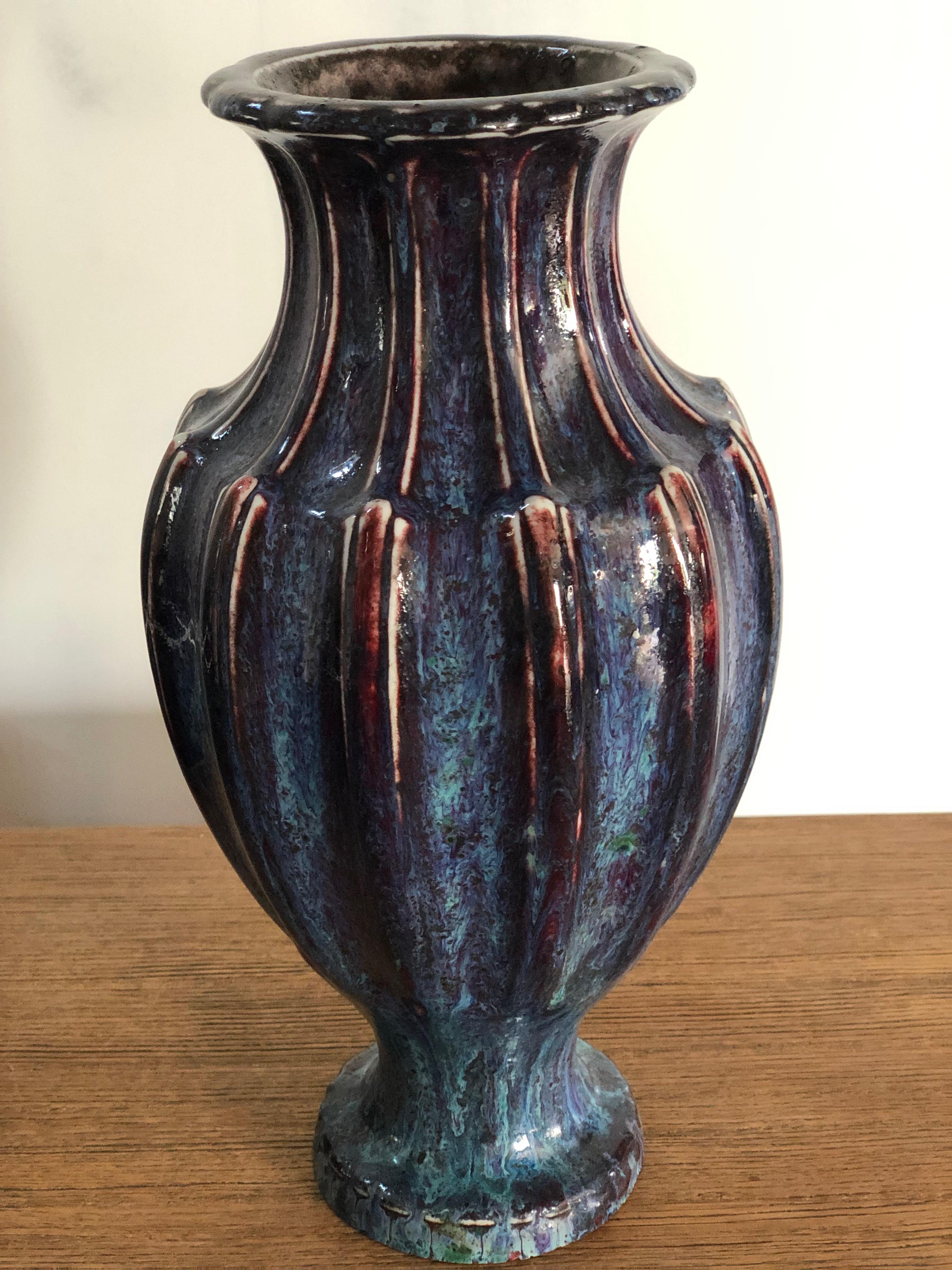 The Manufacture de Sèvres first produced their sang de boeuf glazes in the early 1880s, this is a porcelain vase made in 1889, it is inscribed on the underside AD 89 12 PN and the S89 stamp which has faded slightly. It has great ribbed shape with