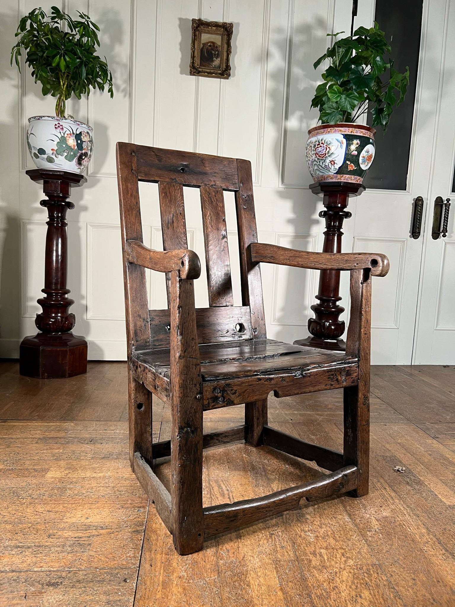 Made on the Isle of Man, from 'reclaimed' or 'found' timbers, this chair was used for restraining and is thought to be from an asylum or prison.

Constructed in the early 19th century, this is a truly rare and macabre item.

The chair comes with a