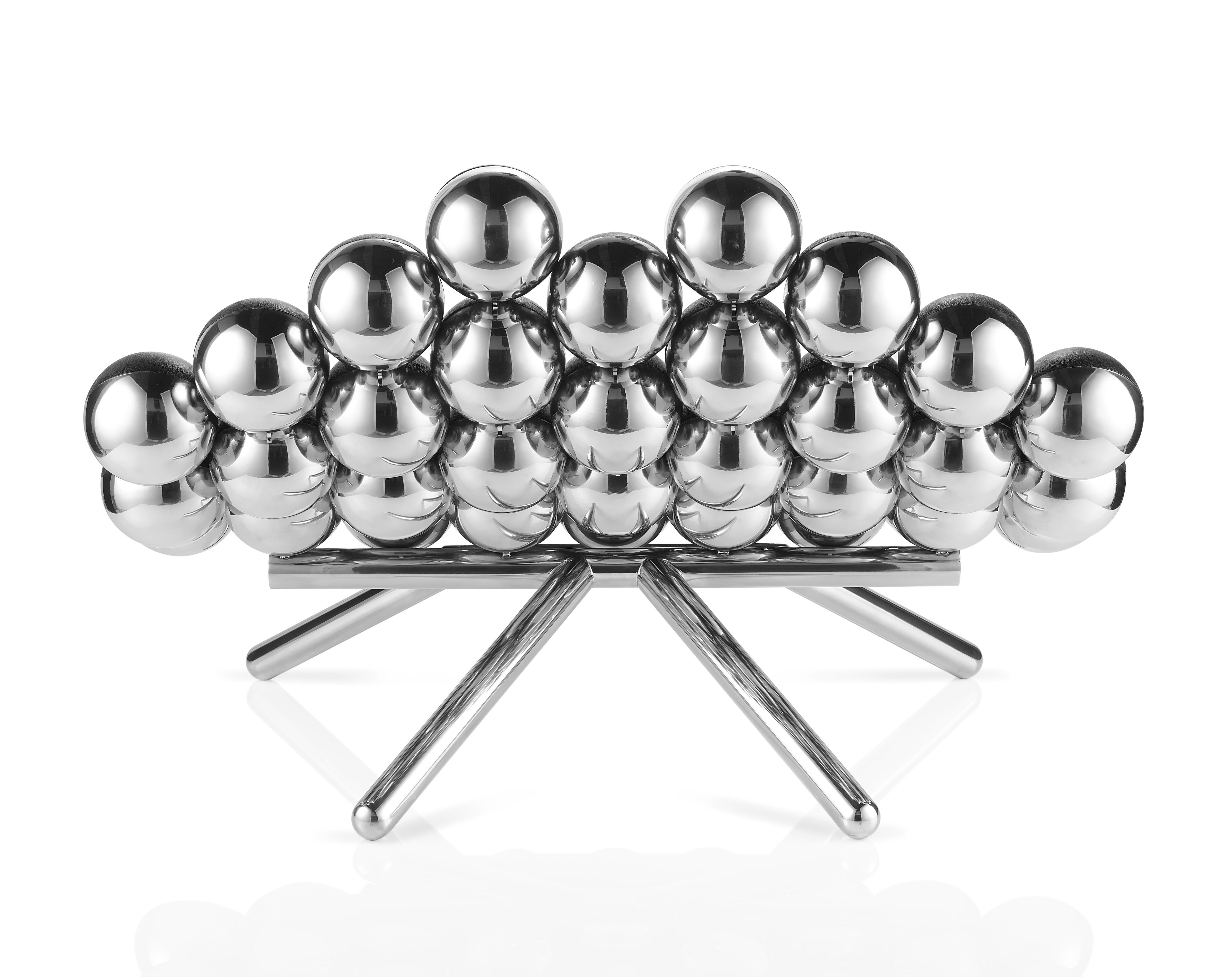 40 spheres carefully balanced to create this unique sofa that challenges the limits of furniture-making.
The unconventional mixture of shapes and textures expresses the artist's vision of sophistication and character.
Flawless mirror polished