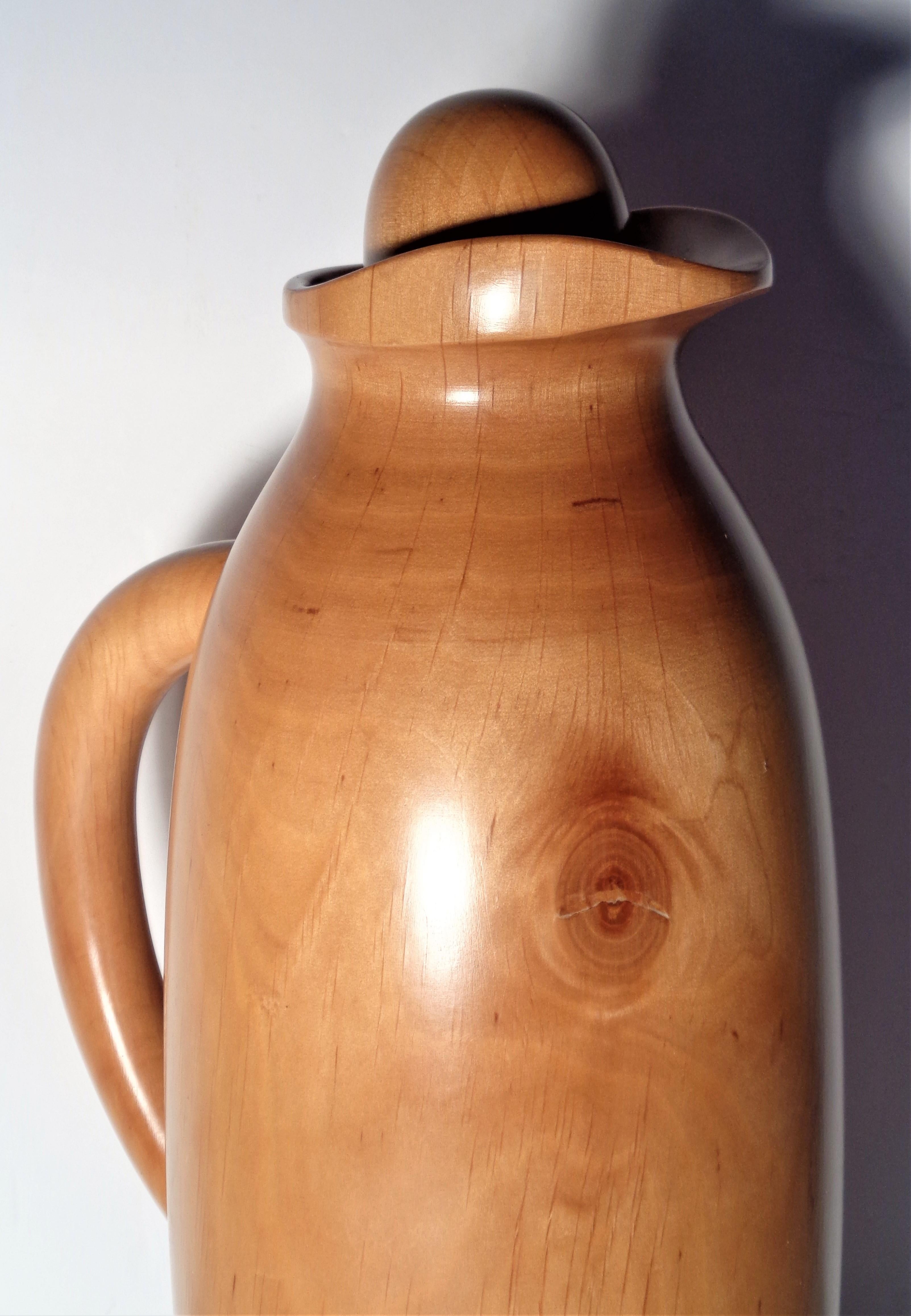 Wood carafe thermos pitcher carafe bar ware item by Manzoni Pietro for Vietri Italy, circa 1970. Hand carved sycamore wood, thermal glass interior, corked stopper. High quality elegant modernist design. Signed and labeled on underside. Look at all