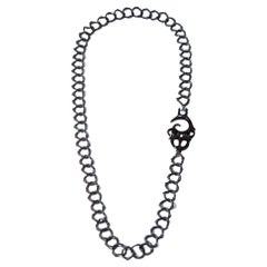 Zweigkette mit Maori-Symbol und Diamant-Halskette 