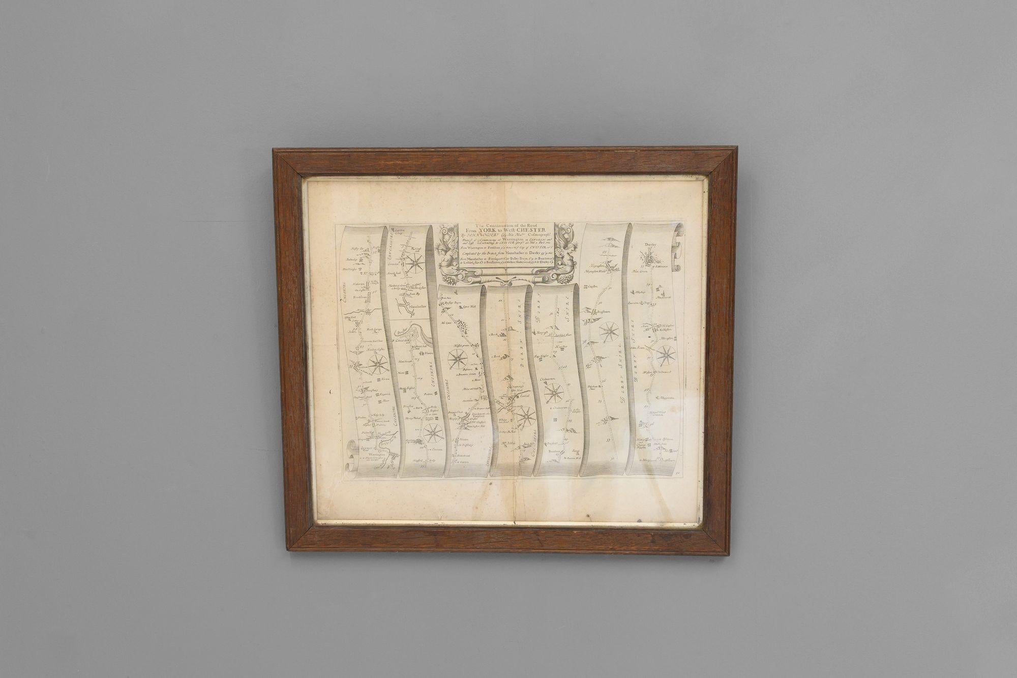 A road map or strip map by John Ogilby, showing the route from Warrington to Derby, taken from the 1698 edition of Ogilby’s ‘Britannia’ map. Later solid oak frame.
U.K circa 1700.
H 52cm x W 58cm x D 3cm