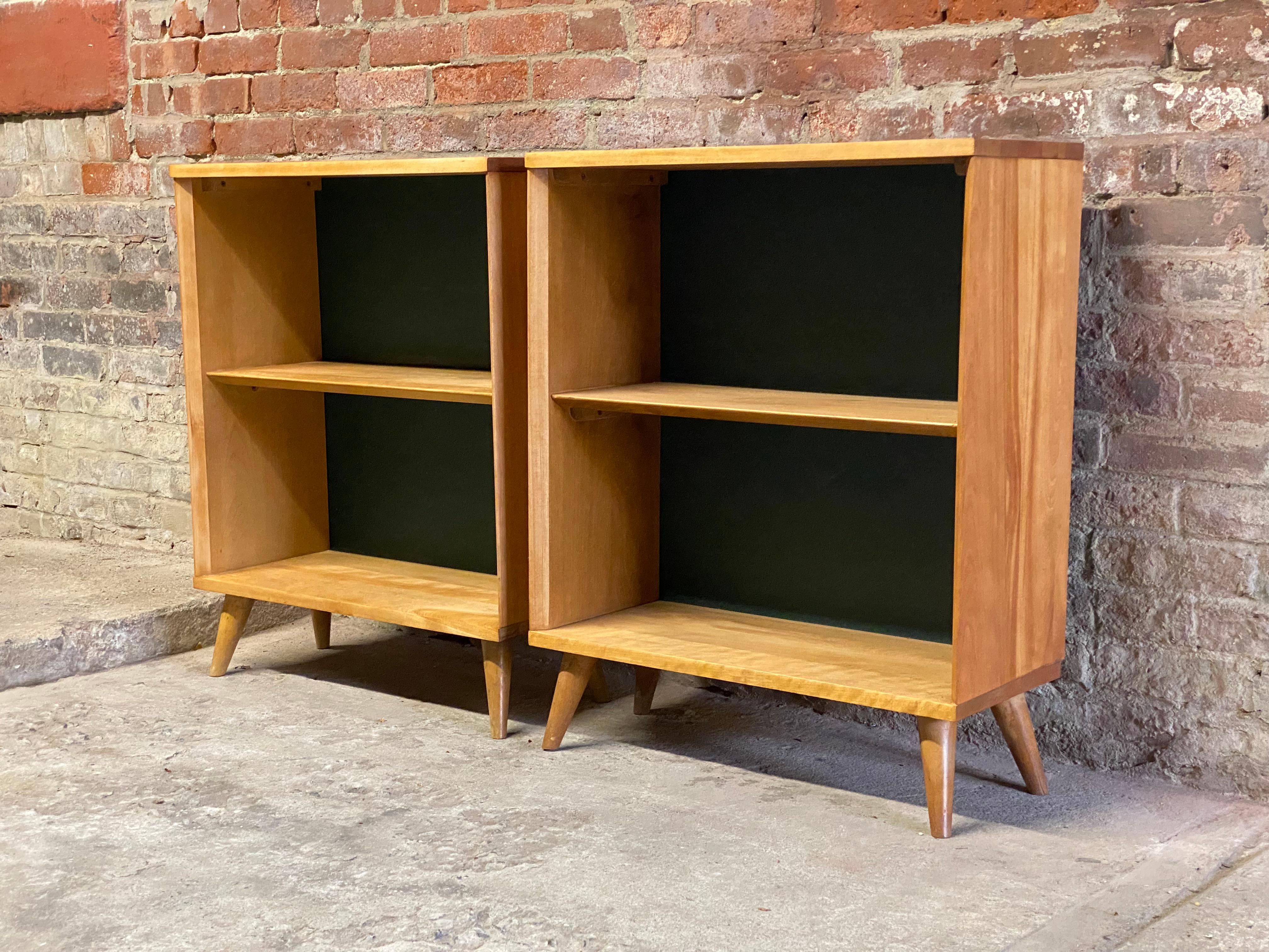 A pair of solid maple with green masonite back bookcases. Great scale and can go anywhere. Circa 1950. Good overall condition and structurally sound and sturdy. Wear commensurate with age and use with bumps, minors scratches, bruises and minor