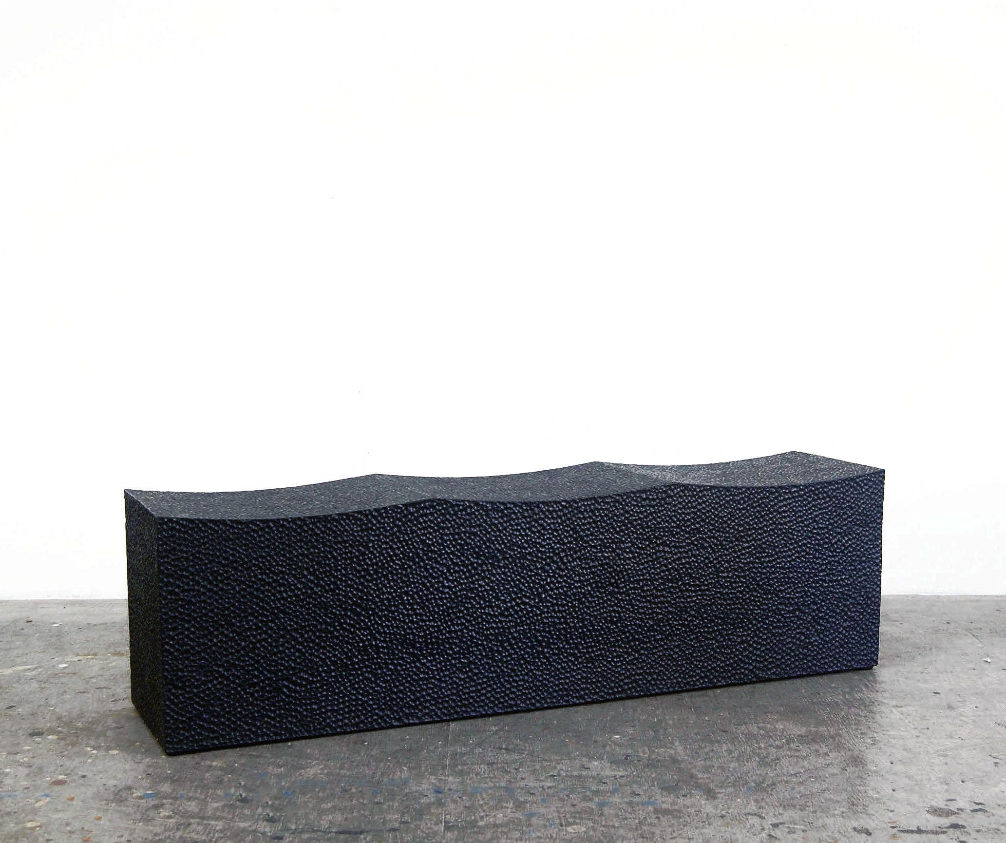 Maple block bench for three by John Eric Byers
Dimensions: 43 x 101.6 x 35.5 cm
Materials: Carved blackened maple

All works are individually handmade to order.

John Eric Byers creates geometrically inspired pieces that are minimal,