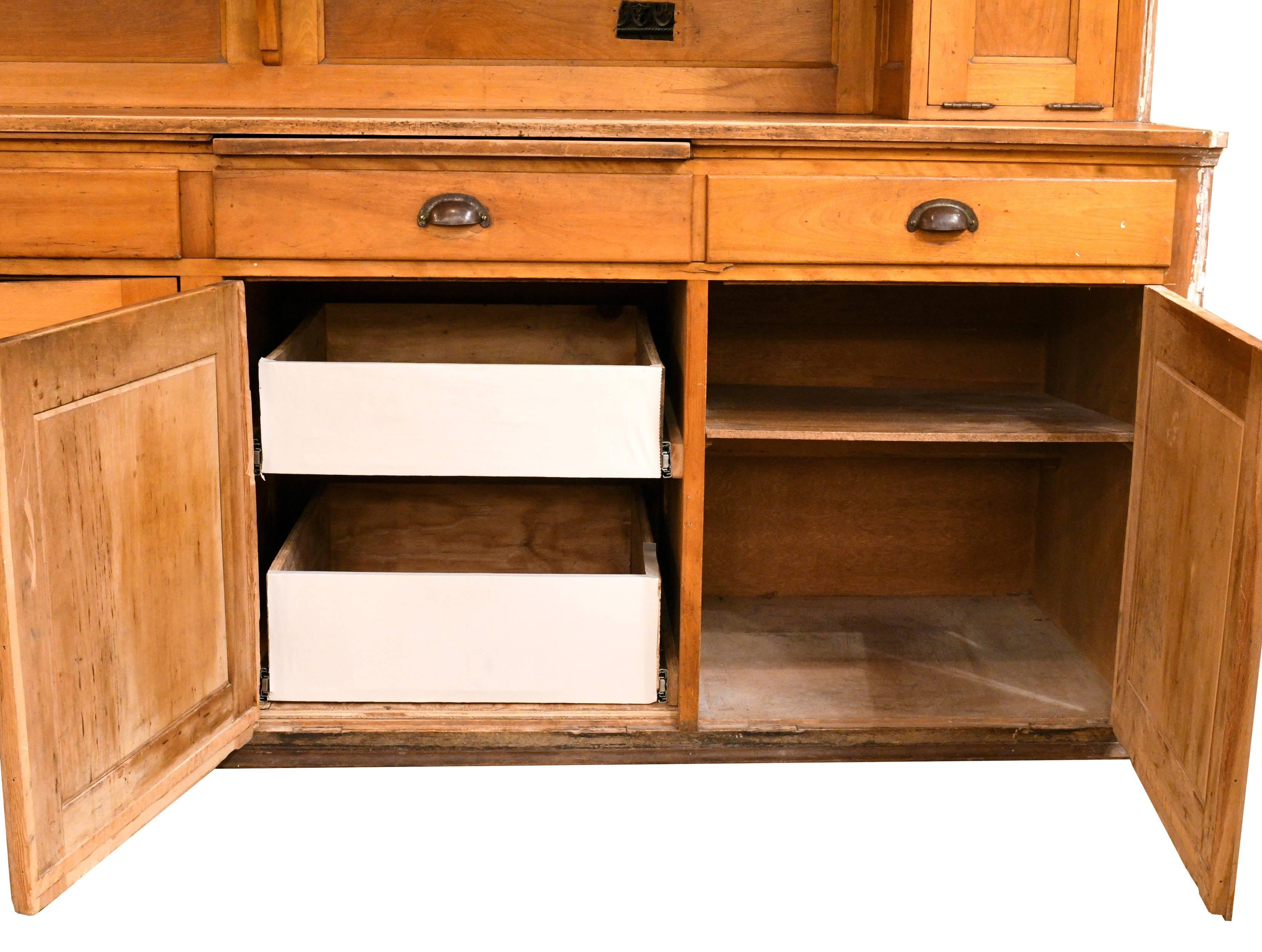 This built-in maple kitchen cabinet was removed from a 1906 home in Minneapolis. Clean, simple lines and ample, practical storage spaces make this unit stand out from the rest. On the very top, two small cabinets offer out-of-the-way storage for