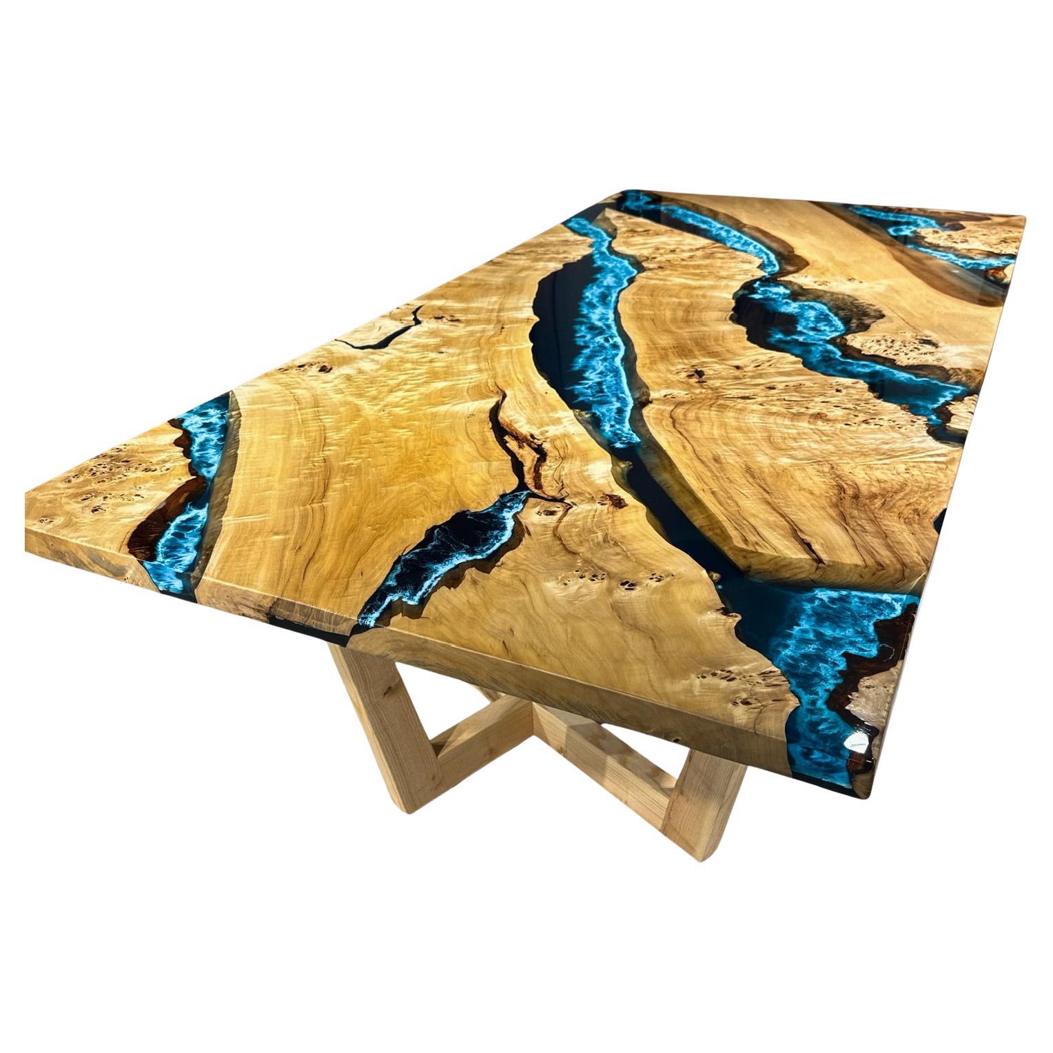 Custom Maple Burl Blue / Turquoise Epoxy Resin Dining Table 

This table is made of Mappa Burl Wood. The grains and texture of the wood describe what a natural mappa burl woods looks like.
It can be used as a dining table or as a conference table.