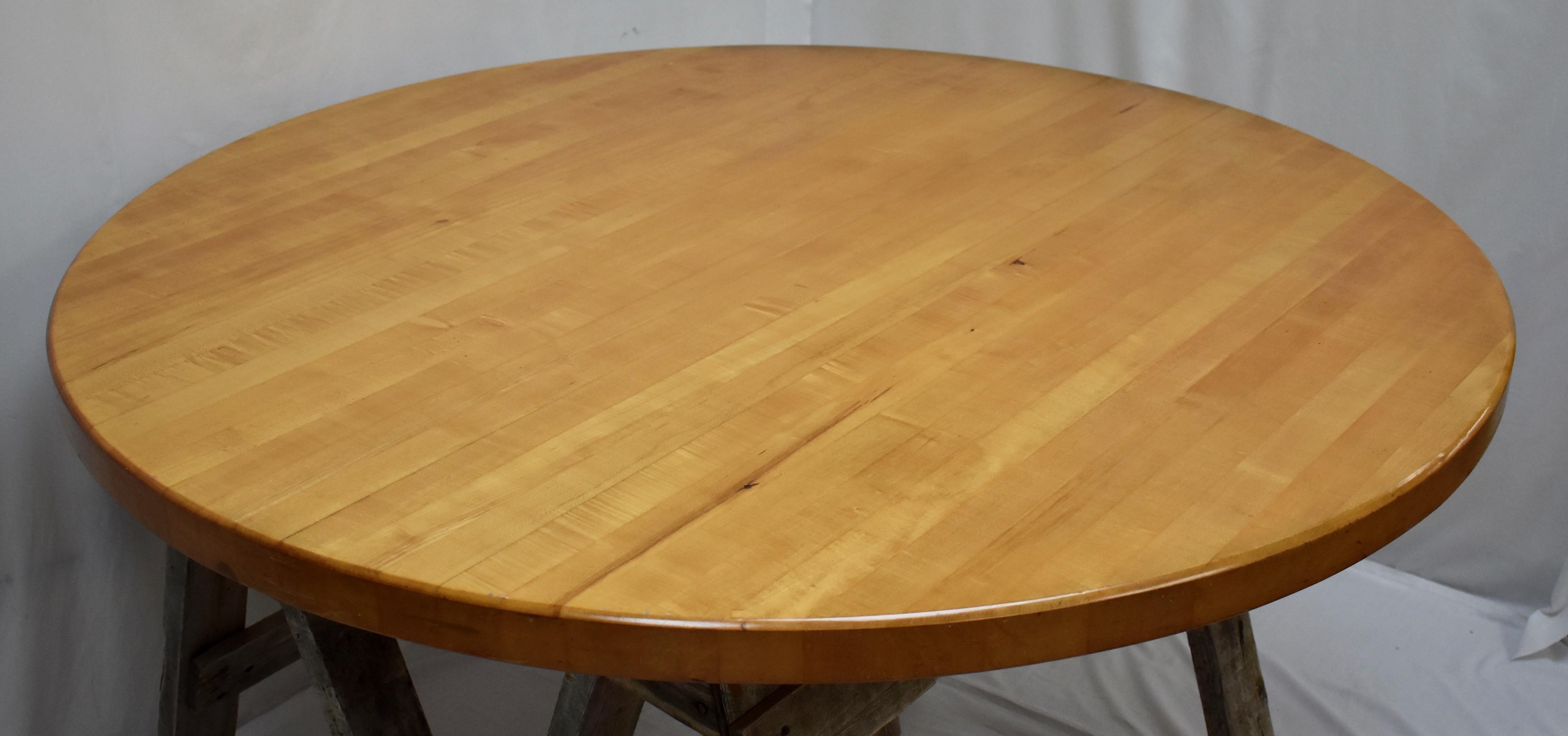 This massive butcher’s block style round tabletop only is made from laminated maple boards over 2” thick, and is only very lightly used. Set it on a sturdy iron base to create a great kitchen table or all-purpose work or play station. In a wipe-off