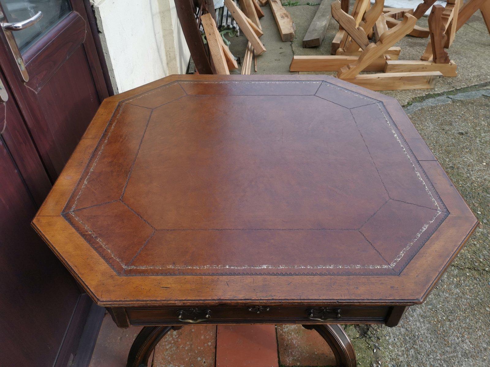 Maple & Co. a Gothic Revival Oak Leather Top Writing Table on Decorative Castors For Sale 4