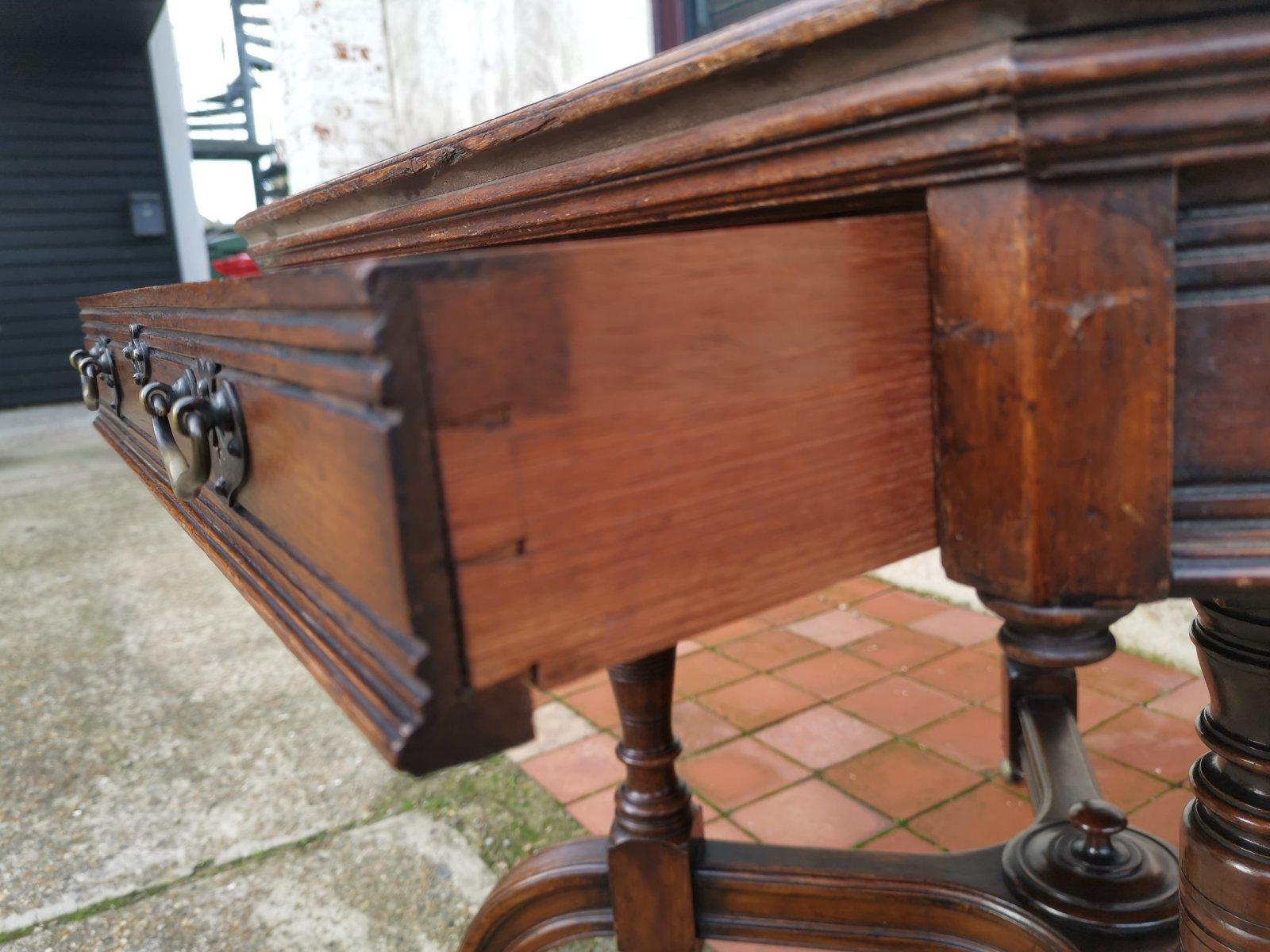 Late 19th Century Maple & Co. a Gothic Revival Oak Leather Top Writing Table on Decorative Castors For Sale