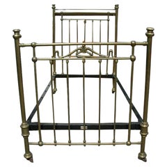 Antique Maple & Co London an Arts & Crafts Brass Single Bed with Stylized Floral Details