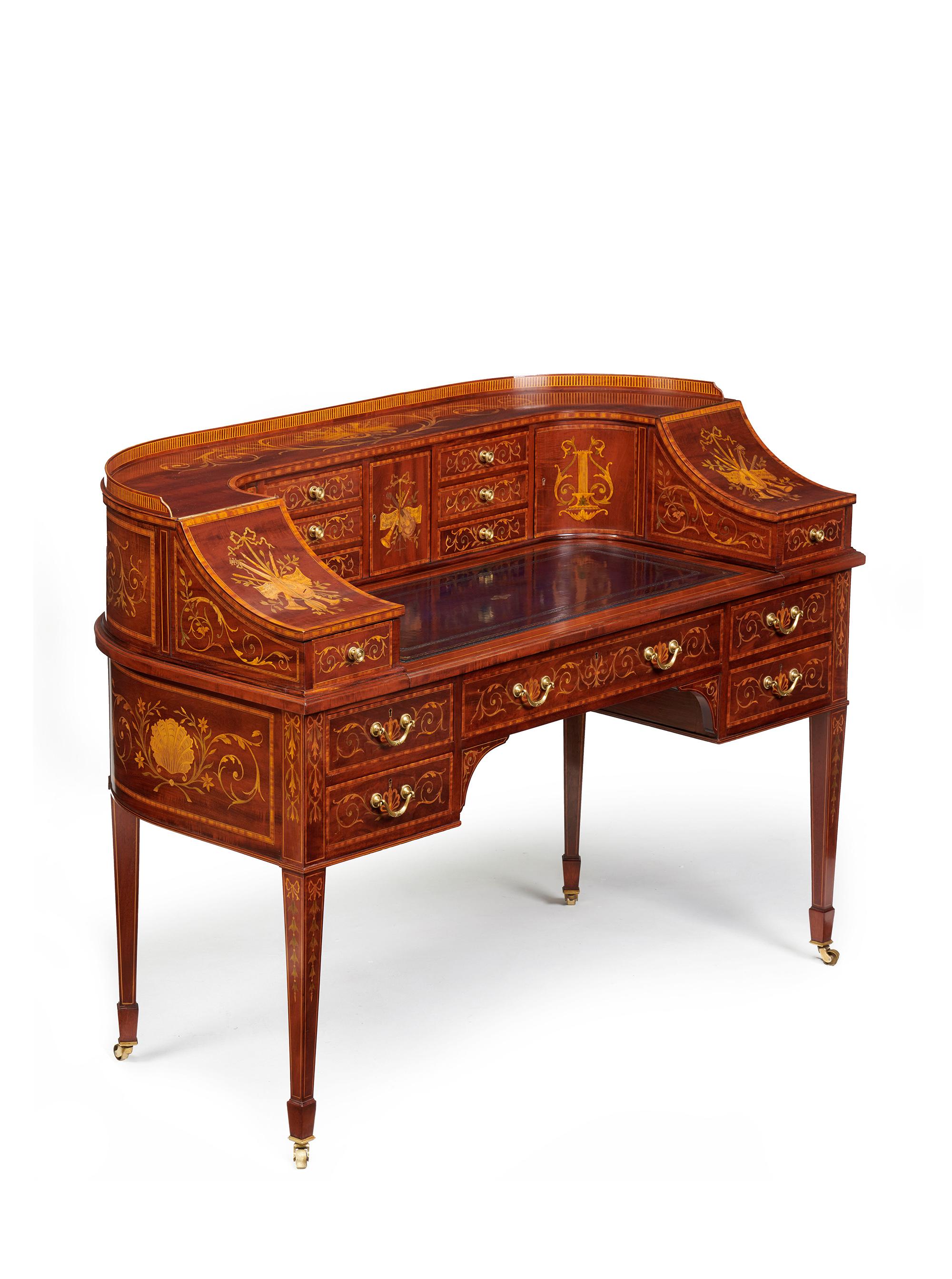 An Exhibition quality mahogany, satinwood and marquetry inlaid 19th century Carlton House Desk made by the renowned London firm and suppliers to Royalty, Maple & Co. Stamped to the central drawer.

English, London made, circa 1880-1900.

Of