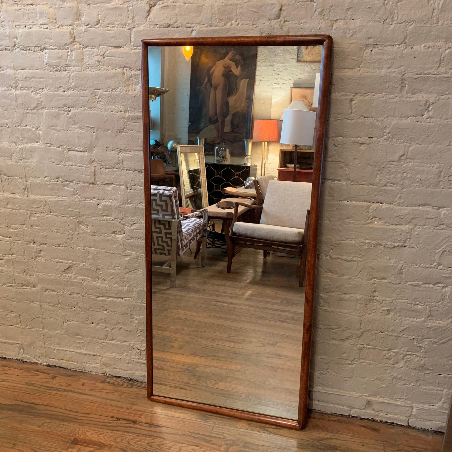 Slender, rectangular, wall mirror attributed to T.H. Robsjohn-Gibbings for Widdicomb features a simple and elegant bullnose maple frame.