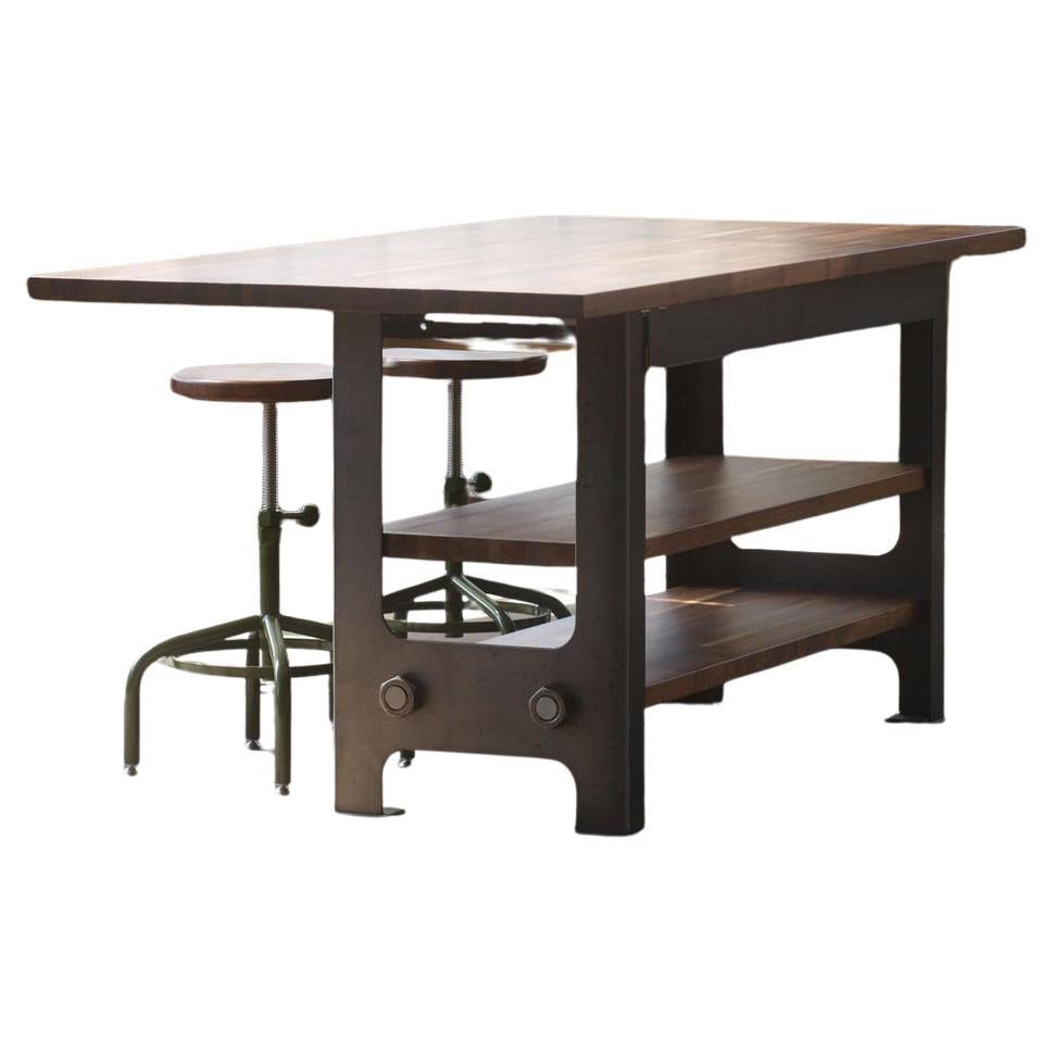 Presenting our stunning kitchen island or worktable, meticulously crafted in the USA from the finest domestic materials. This eye-catching piece boasts a handcrafted solid maple butcher block top paired with a sleek steel base, combining durability