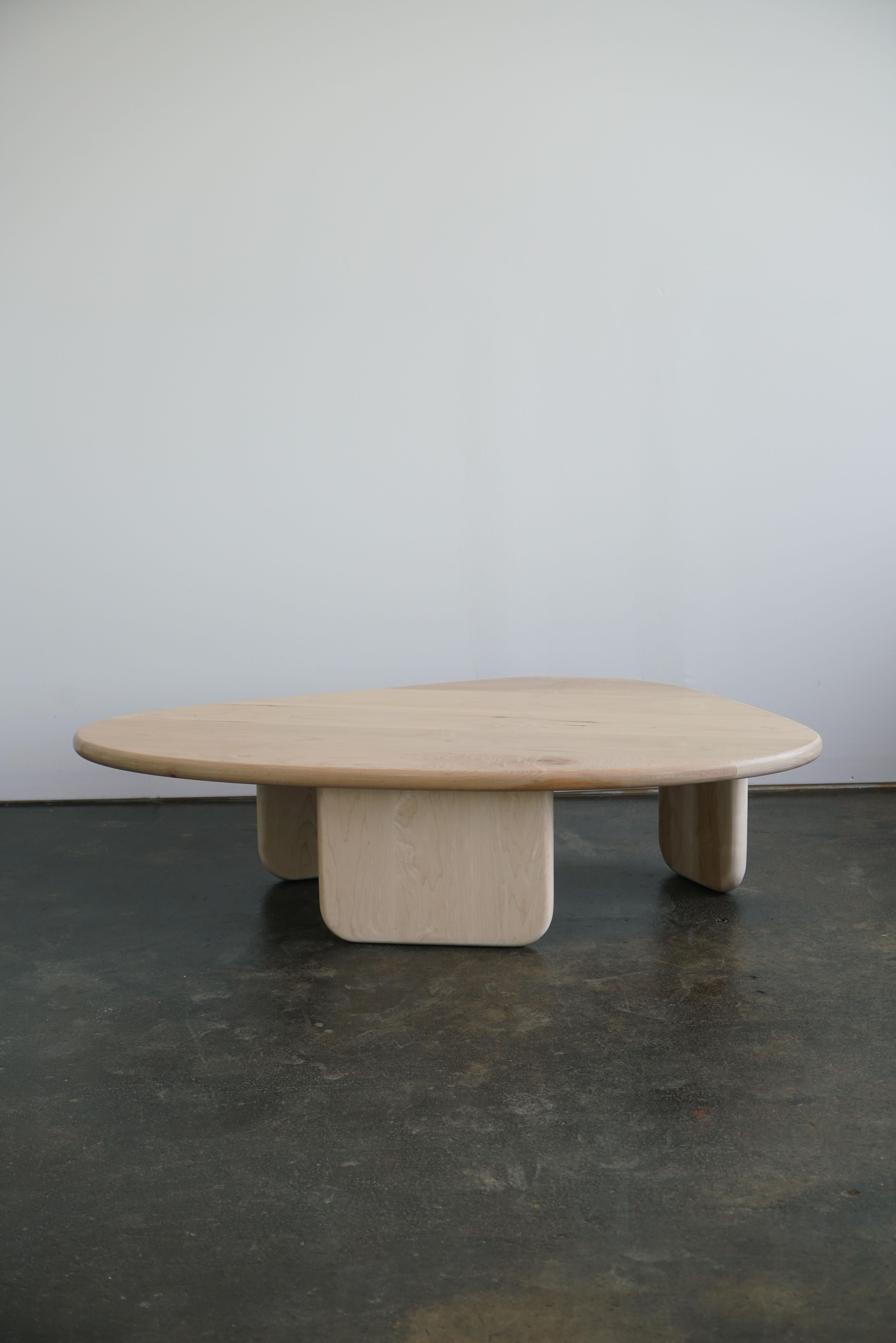 Organic shaped coffee table by Last Workshop, 2022

The table has three different sized legs that are attached to the table top via hidden joinery.

In solid hard Maple, natural finish

Dimensions: 58”L x 32”W x 15”H
Custom sizes and finishes are