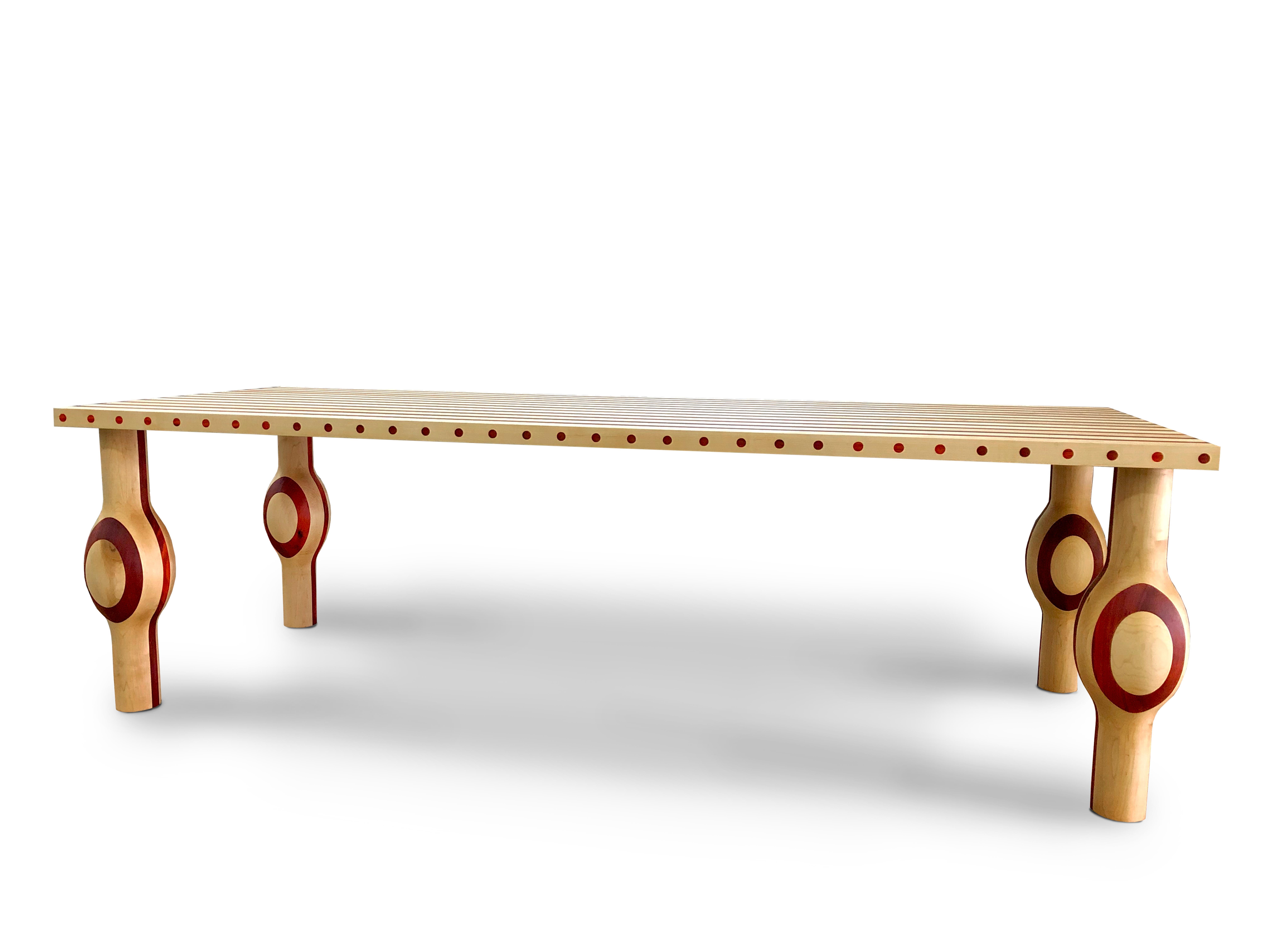 Part of the Striped Series collection by Troy Smith from Troy Smith Studio

Solid woods maple and Padauk come together to form a beautifully shaped and proportioned dining table. The table top and legs are solid wood, the table top is 2