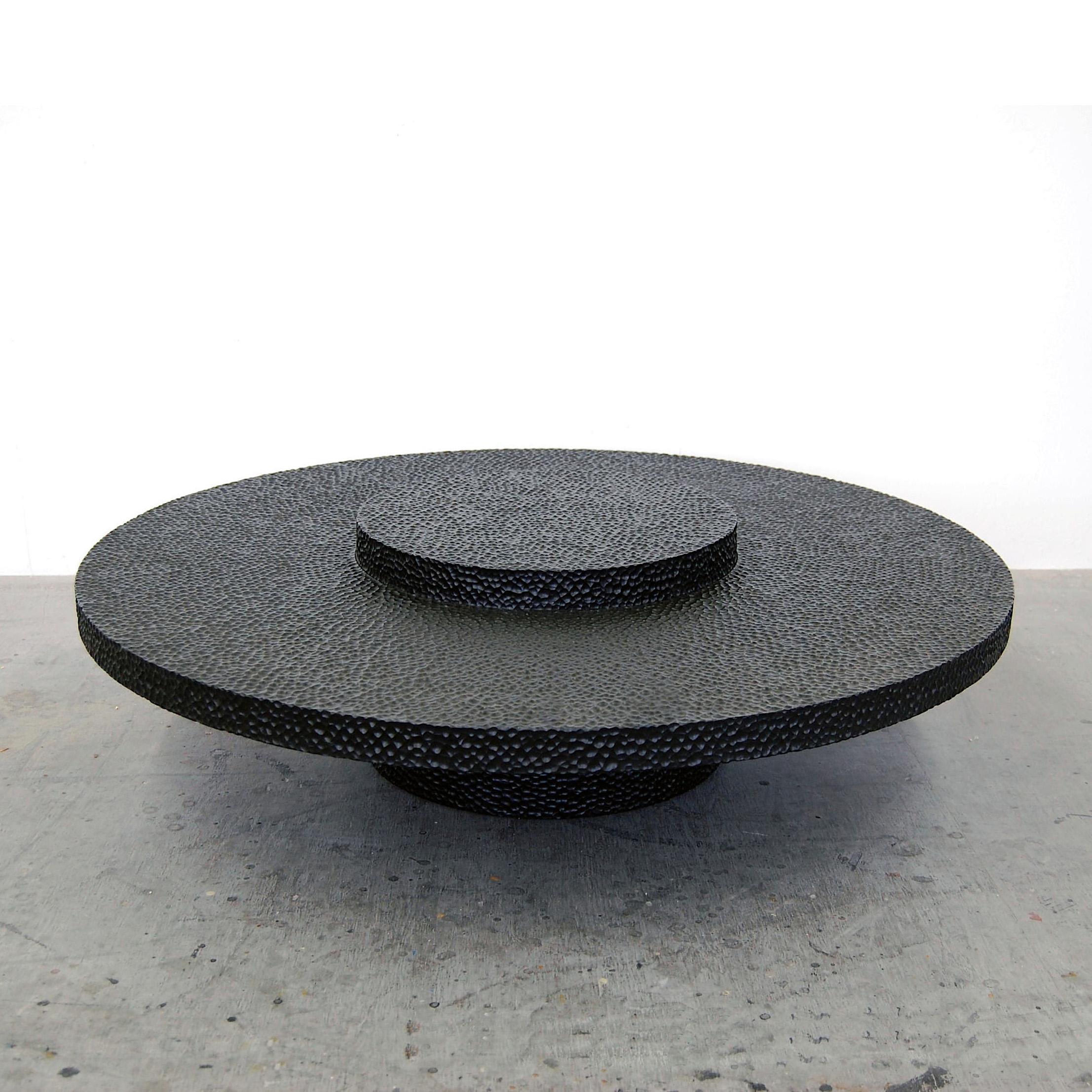 Maple round table sculpted by John Eric Byers
Dimensions: 33 x diameter 122 cm
Materials: carved blackened maple

All works are individually handmade to order.

John Eric Byers creates geometrically inspired pieces that are minimal, emotional,