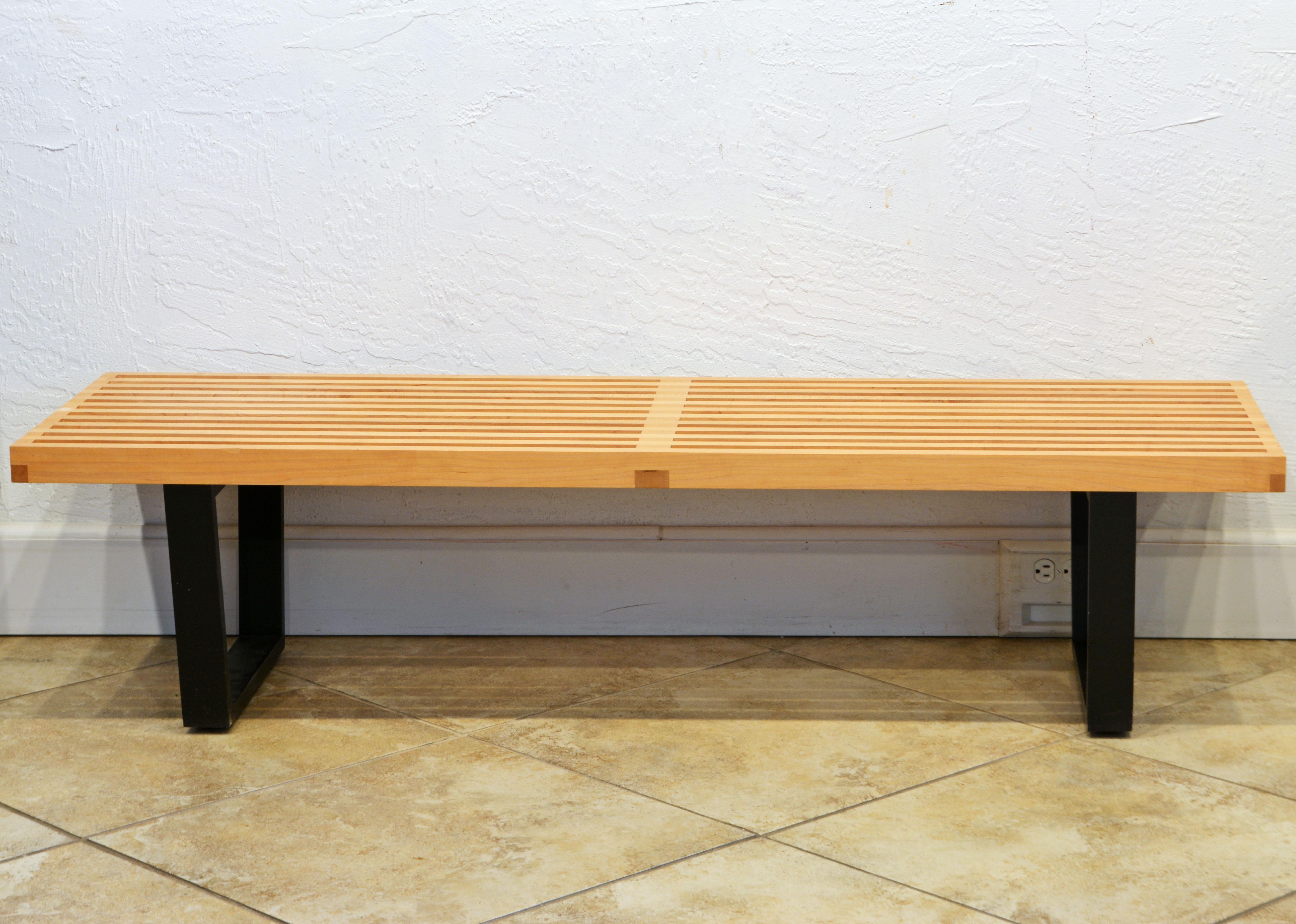 An icon of mid-century modernism, the Nelson Platform Bench with ebonized wood base offers utility and beauty. It can serve as a seat or a table, with units able to be ganged together to create a larger surface. Finger-jointed ebonized maple legs