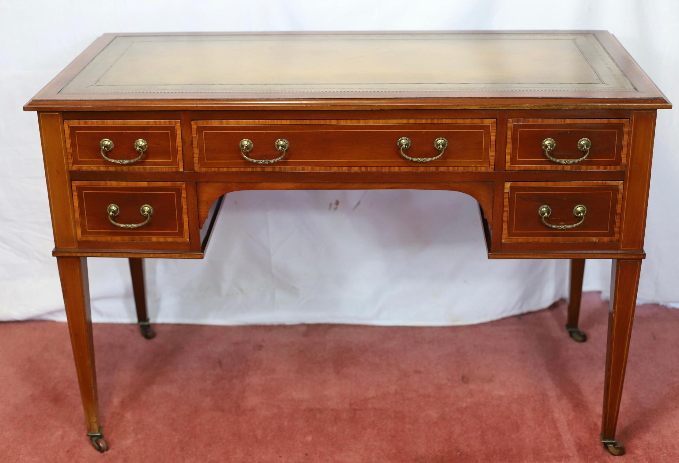 We delight to offer for sale this lovely Edwardian  crossbanded walnut  desk, by Maple & Co, of George III style, first quarter 20th century, the tooled leather writing surface above five drawers, on square tapering legs to castors, stamped Maple &