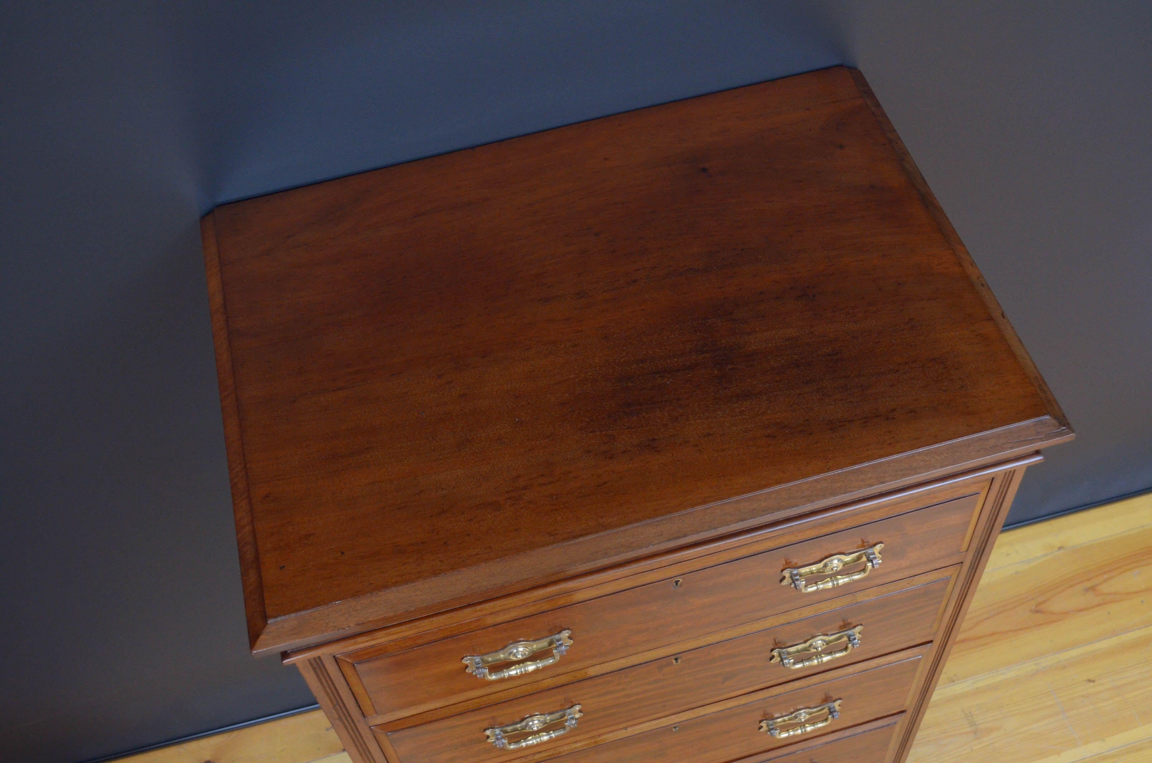 Sn5220 Edwardian mahogany tall chest of drawers by Maples, having figured top with moulded edge above five, mahogany lined, fielded and graduated drawers, all fitted with original brass handles and flanked by reeded pilasters, all standing on